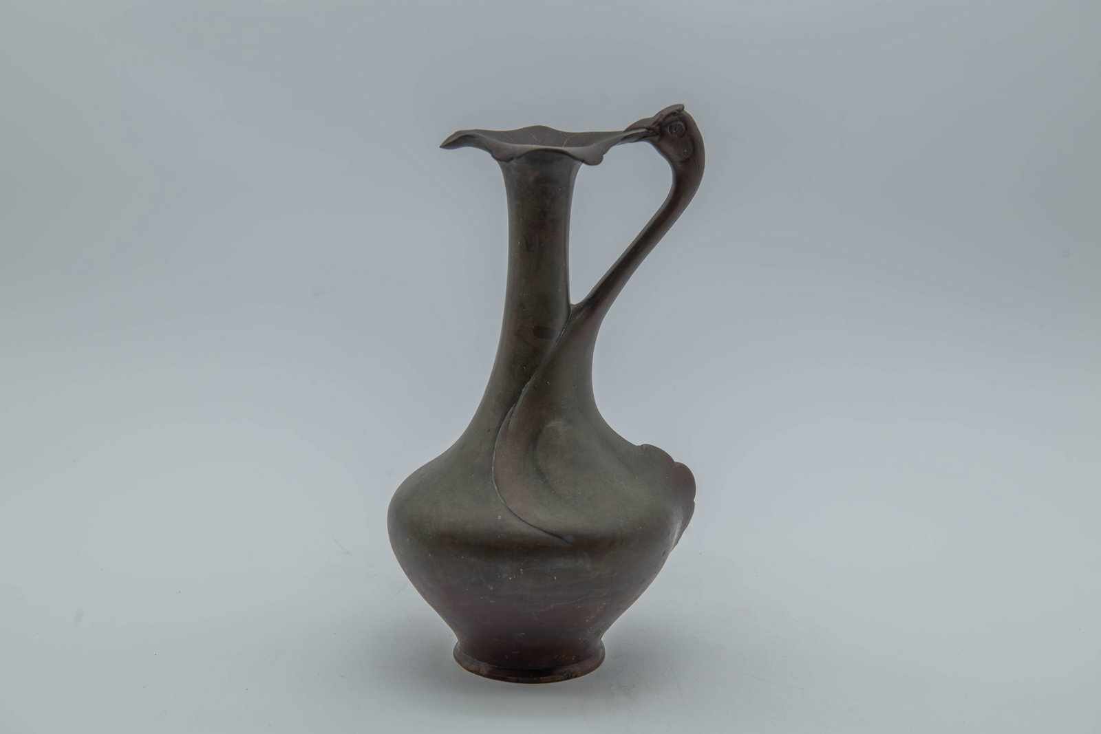 Vintage/Antique Art Nouveau Style Sculptural Design Heavy Bronze Vase: Vintage/Antique Art Nouveau Style Sculptural Design Heavy Bronze Vase. Sculptural handle likely depicting a swan or stylized bird, with a flared, fluted rim resembling a flower blossom. Measures appro