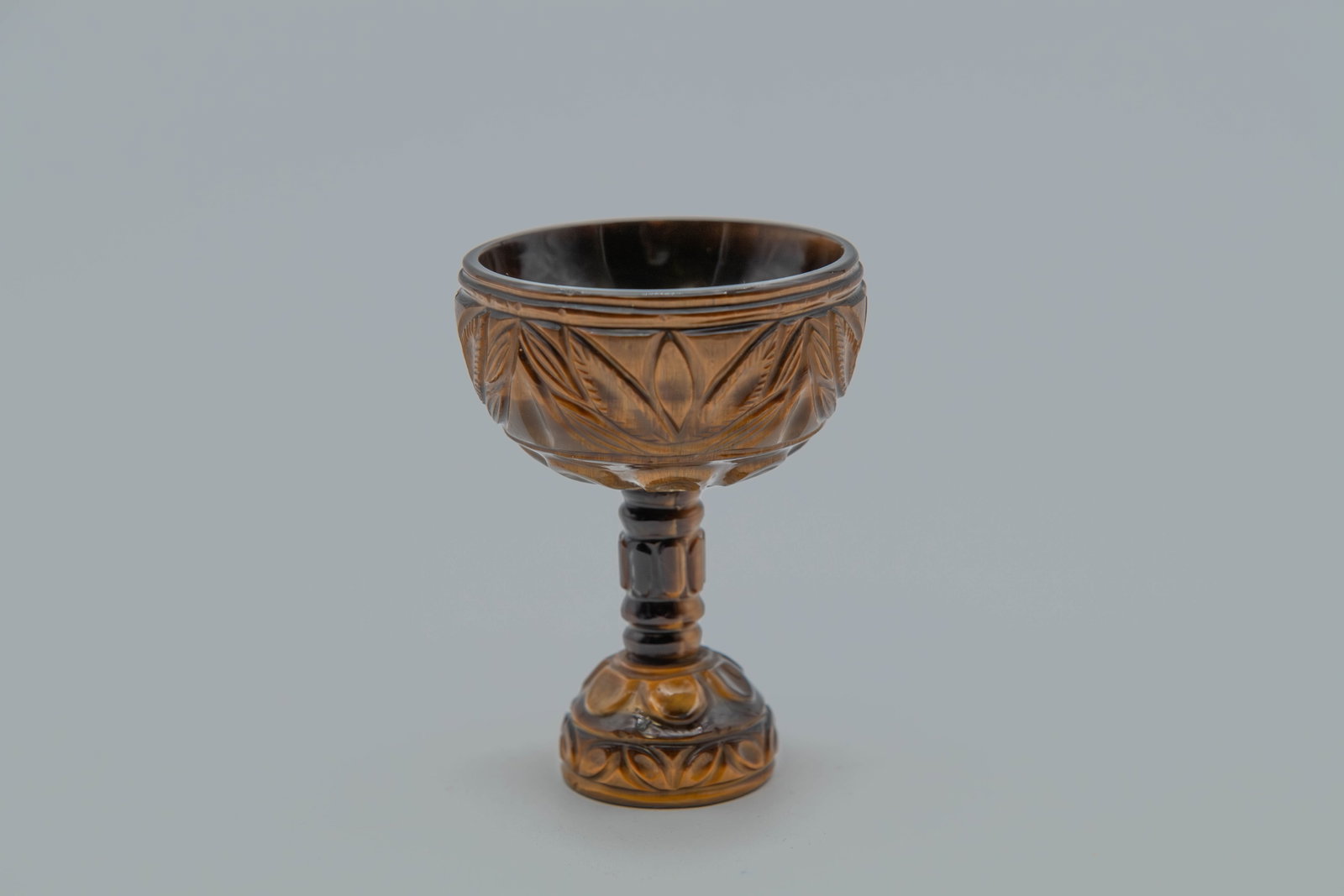 Lovely Vintage Carved Natural Tiger's Eye Stone Goblet: Lovely Vintage Carved Natural Tiger's Eye Stone Goblet. Size: 2"1/2W x 3"1/2H; Good overall condition, with natural stone pattern.