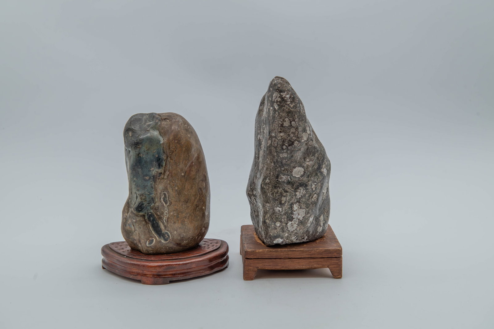 Lot of 2 Natural Viewing Stones w/Carved Wooden Base: Lot of 2 Natural Viewing Stones w/Carved Wooden Base. Measures approx. 6"1/4L x 4"1/4W x 2"1/4D and 7"L x 3"1/2W x 4"D