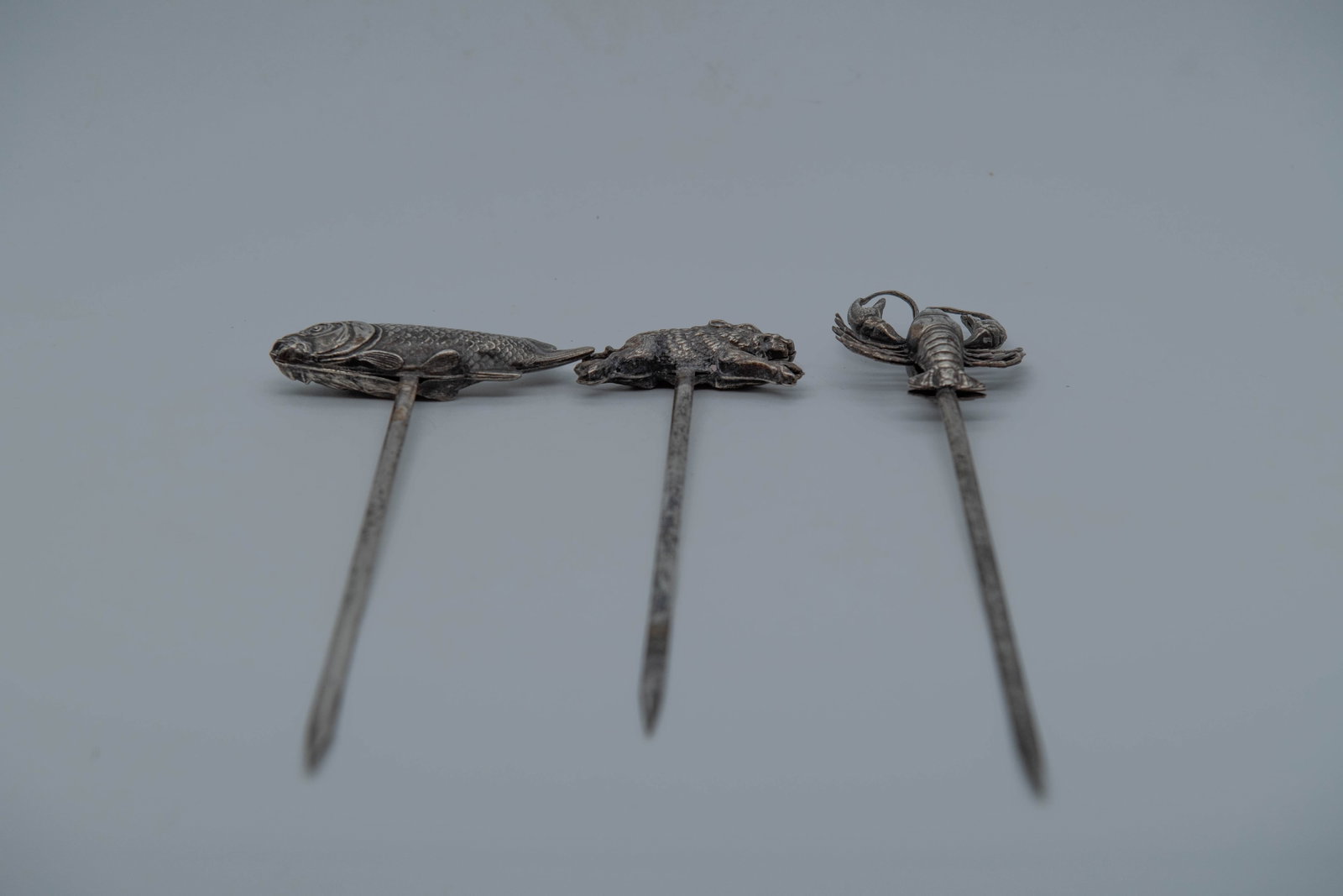 Lot of 3 Vintage France Silver Tone Cocktail Picks w/Lobster, Fish & Wild Boar Figure: Lot of 3 Vintage Long & Slender Silver Tone Cocktail Picks w/Lobster, Fish & Wild Boar Figure, France Mark. Total length 8"1/2 and 10"; In Good condition