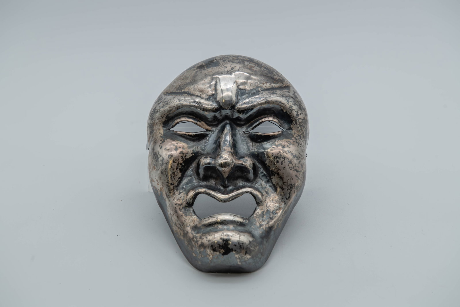 Vintage Antique Japanese Silver Carved Theater Mask: Vintage Antique Japanese Silver Carved Theater Mask. Tested as Silver. This mask likely a traditional Kyogen or Noh mask used in theater, depicting a specific character or emotion. In good condition, 