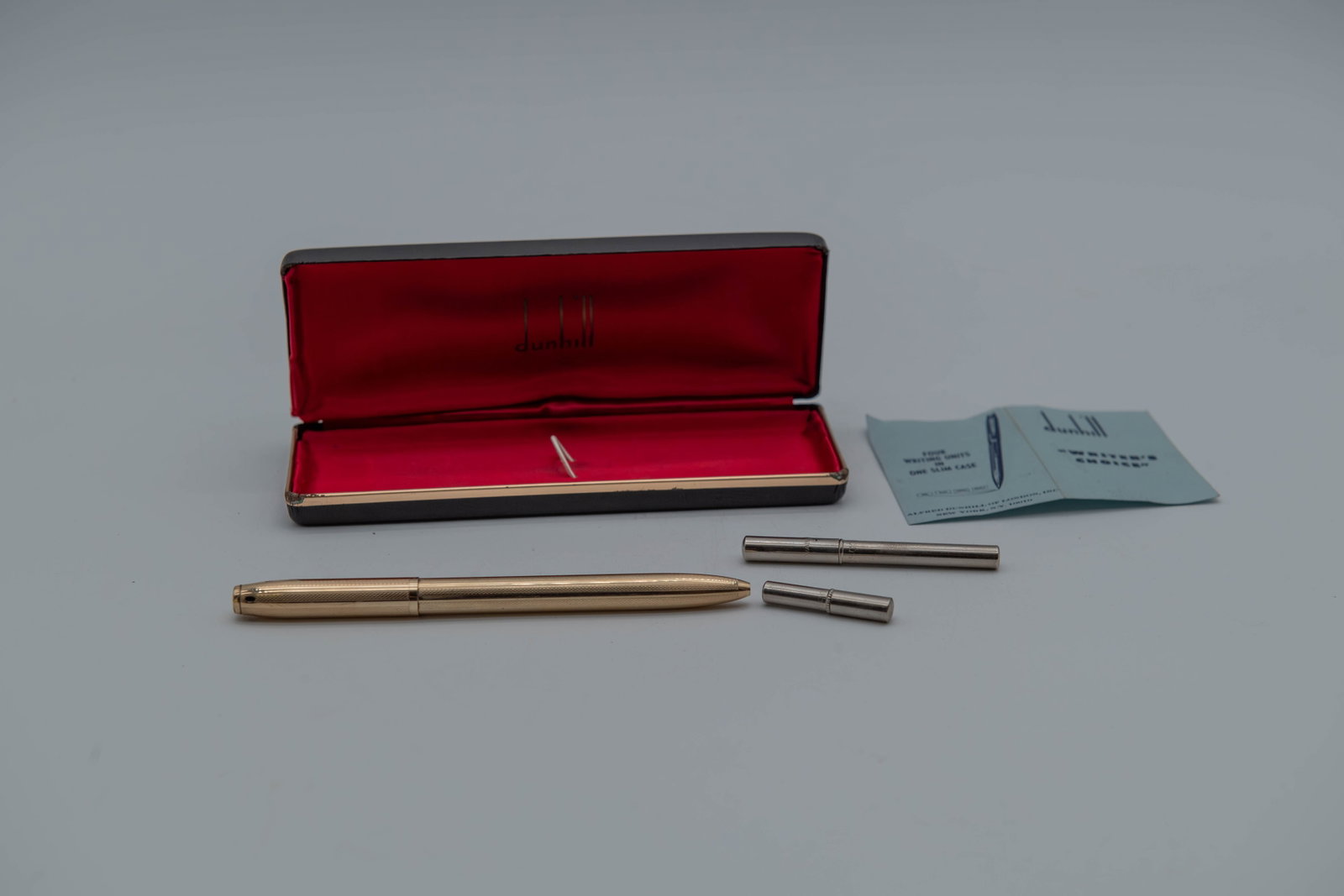 Vintage Dunhill "Writer's Choice" Gold Plated Ballpoint Pen w/ Ballpoints Refill & Pencil Lead in: Vintage "Writer's Choice" Gold Plated Ballpoint Pen, Marked Dunhill w/ Ballpoints Refill & Pencil Lead in Original Box. The pen bears a clear "Dunhill" mark. Additional inscriptions, including "German