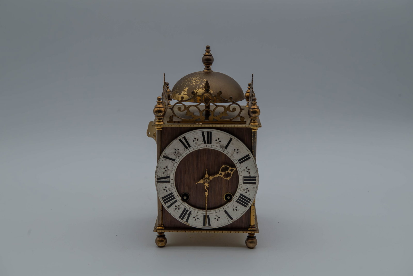 Vintage French Miniature Brass Lantern Clock w/Key: Vintage French Miniature Brass Lantern Clock w/Key. UW 20/31, No 111227, with Key. Measures 4"3/4L x 4"3/4W x 8"1/2H; Overall in good vintage condition, with wear consistent with age and use. The cloc