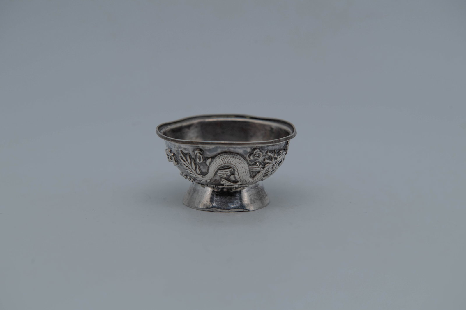 Antique Chinese Export Silver Footed Bowl w/Dragon Motifs, Marked by Maker "威海文: Antique Chinese Export Silver Footed Bowl w/Dragon Motifs, Marked by Maker "威海文華順". Measures 2"W x 1"H; Total weight 11.2g; Overall in good antique condition