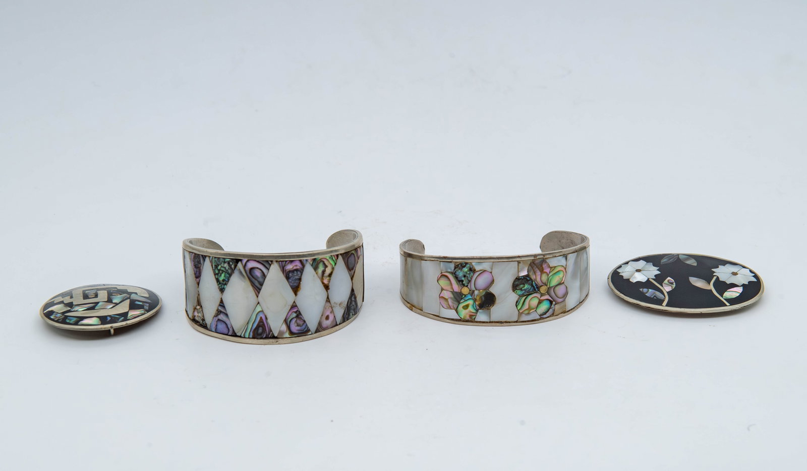 Lot of 4 Vintage Mexico Silverplated Cuff Bracelets & Brooch Pins w/MOP Inlay, Marked: Lot of 4 Vintage Mexico Silverplated Cuff Bracelets & Brooch Pins w/Mother of Pearl Inlay, Marked. 1)Cuff bracelet size 2"3/4 x 1" and 2"1/2 x 1"1/4. 2)Brooch pin 2"1/4 x 1"1/2 and 1"3/4Dia. Overall i