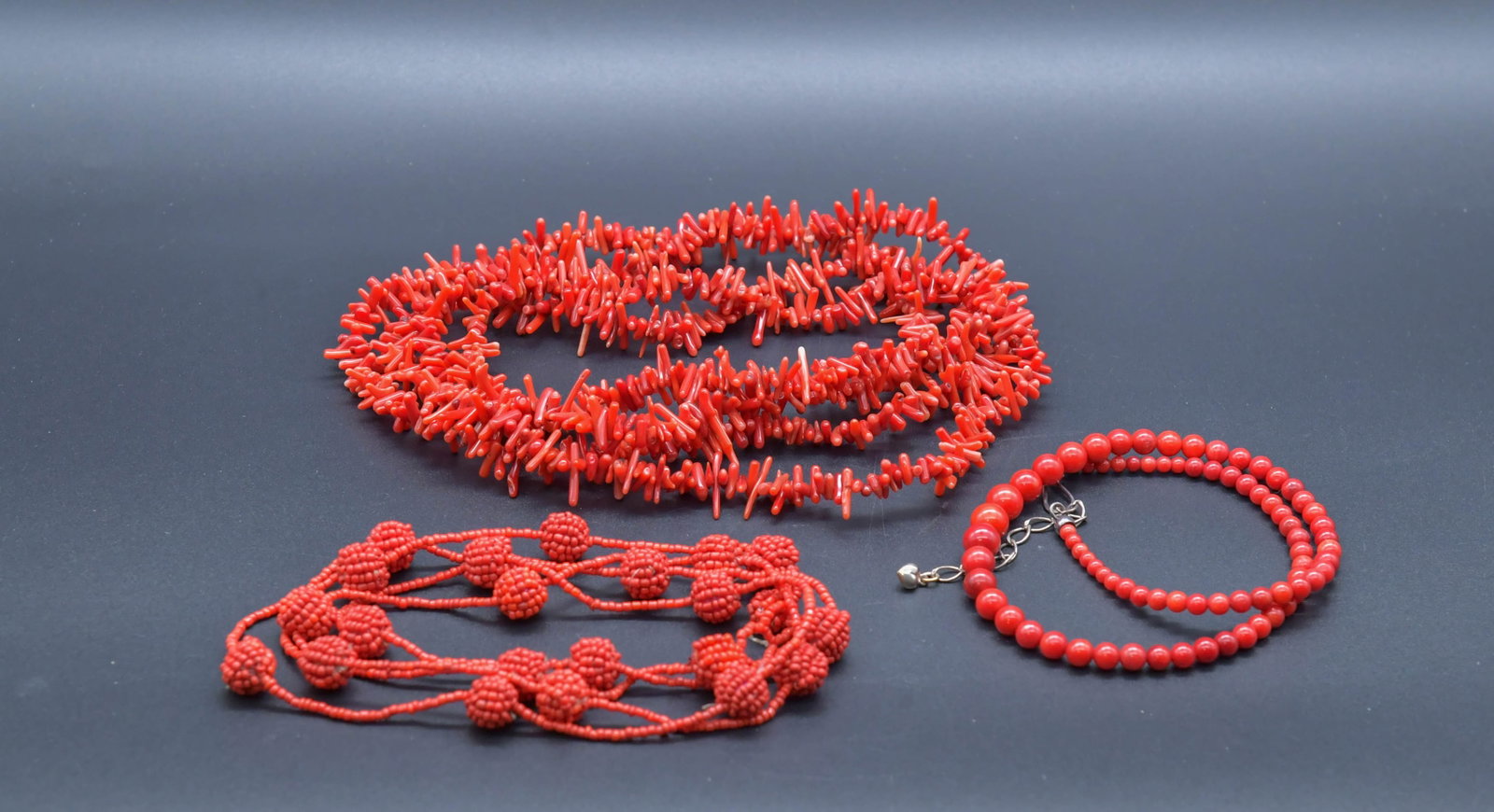 Lot of 3 Vintage Red Coral Necklaces: Lot of 3 Vintage Red Coral Necklaces. 1) Red round coral beads & sterling silver clasp necklace 21"L, 3.9mm to 9.1mm; 2) Red coral branches necklace 31"L; 3) Red Coral beaded necklace/sautoir necklace