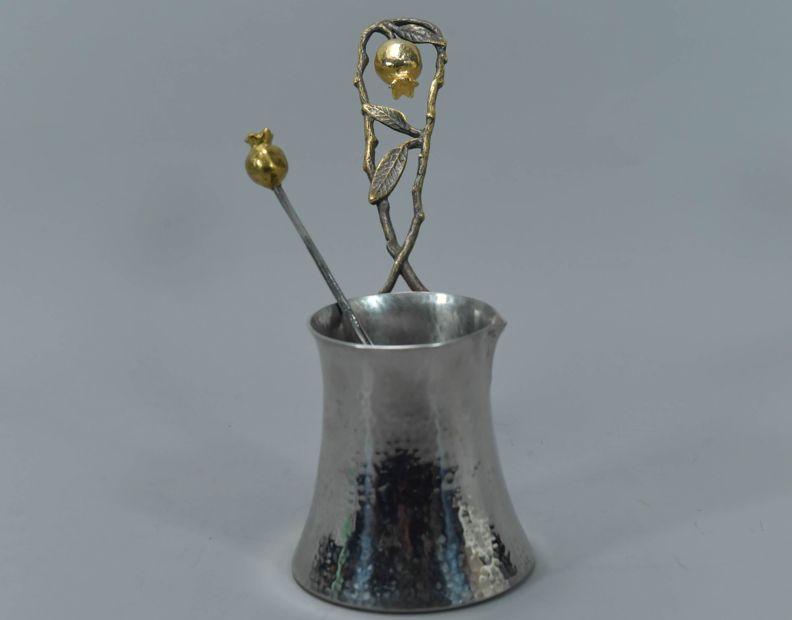 "Michael Aram" Pomegranate Coffee Pot w/Spoon, Signed: Designer Michael Aram Pomegranate Coffee Pot w/Spoon, Signed. The pot and spoon are handcrafted from materials such as stainless steel, nickel-plate and natural brass. Pot 4"1/4H x 4"W, Spoon 8"L; In 