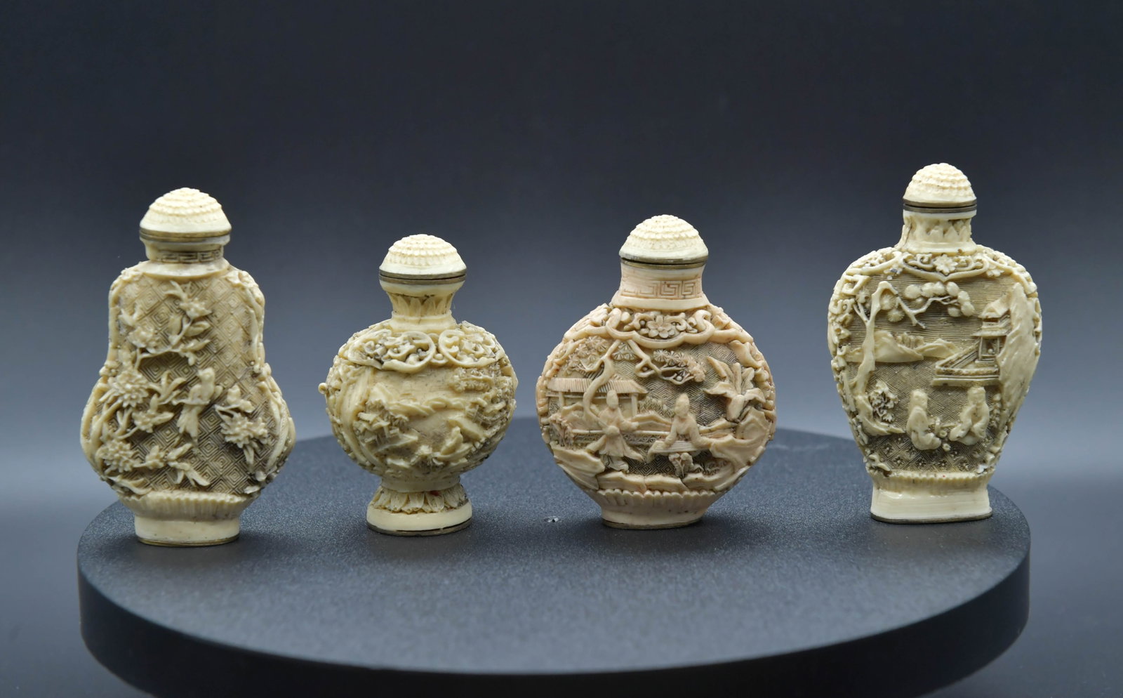 Group of 4 Vintage Chinese Carving Snuff Bottles: Group of 4 Vintage Chinese Carving Snuff Bottles. Tall 2"1/2 to 2"3/4; In good condition, (Stand Not Included)