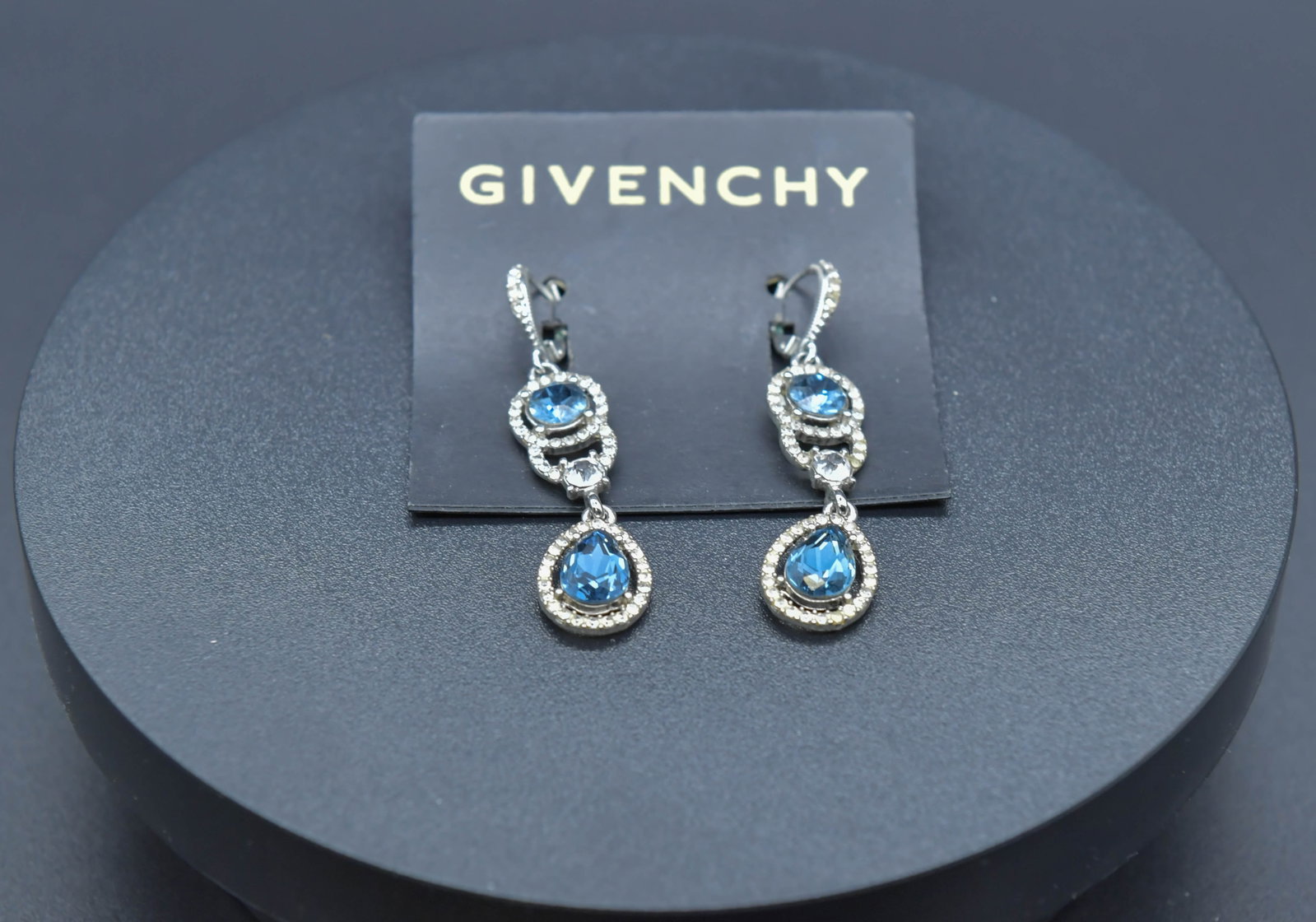 GIVENCHY Blue Stone & Crystal Silver-Tone Teardrop Earrings: GIVENCHY Blue Stone & Crystal Rhinestone Silver-Tone Teardrop Earrings. New on Card. Total length 2", New condition on Macy's tag. (Stand Not Included)