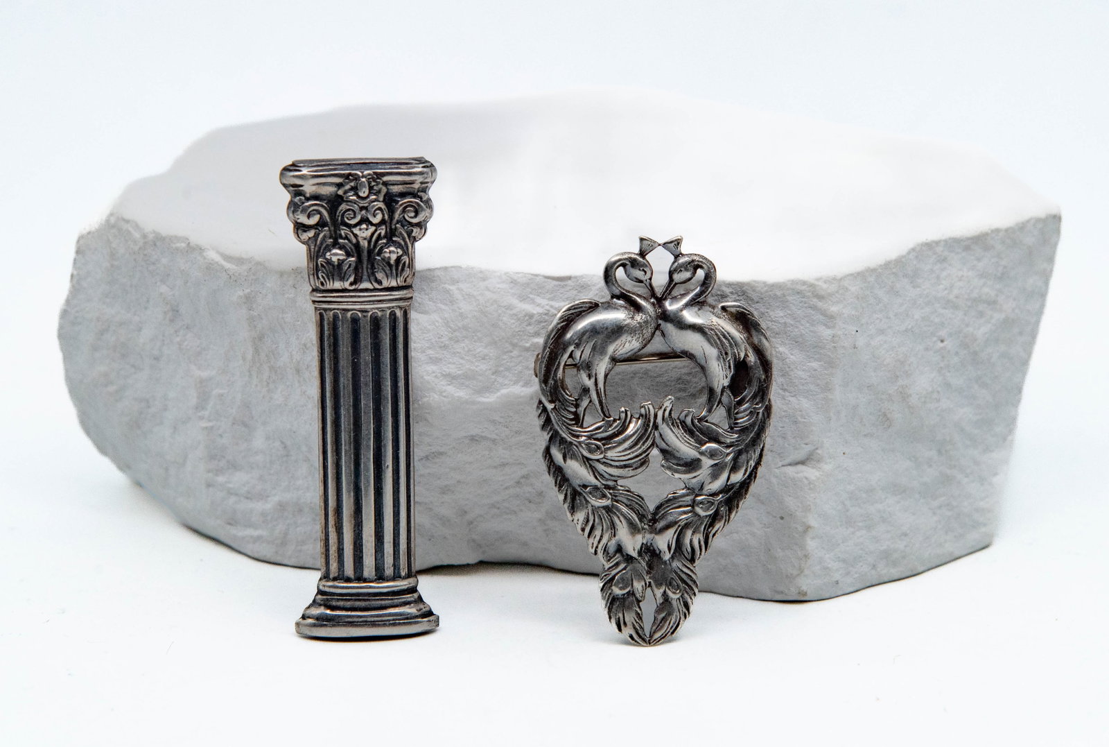 Lot of 2 Vintage Uniquely Designed Silver Brooch Pin: Lot of 2 Vintage Uniquely Designed Silver Brooch Pin. 1)Greek column stamping 2"1/2L x 3/4"W; 2)A heart-shaped design of two peacocks facing each other, 2"1/4L x 1"1/4W; Total weight 13.7g. In good co