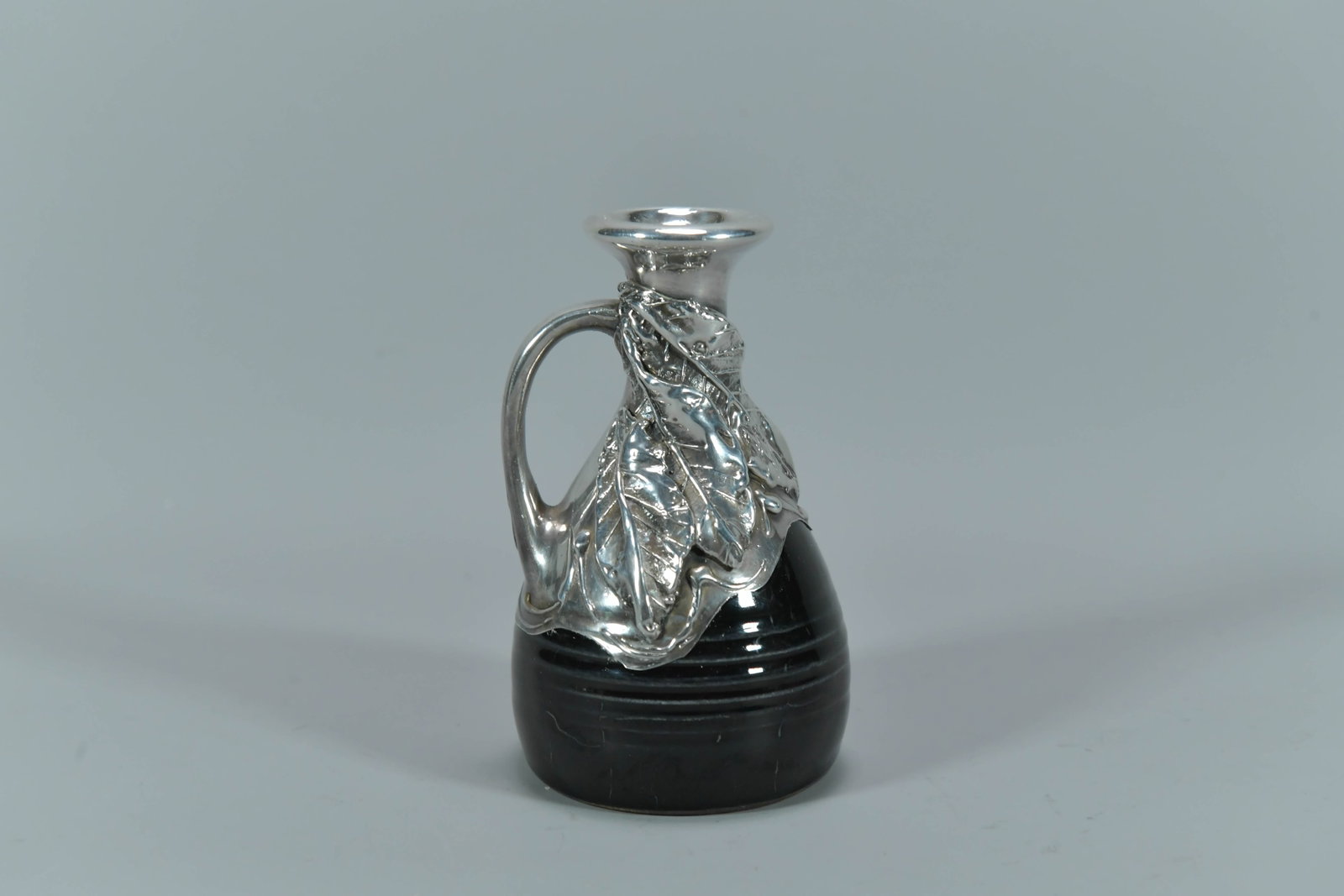 Vintage Marked 925 Sterling Silver Overlay Black Glazed Porcelain Decanter: Vintage Marked 925 Sterling Silver Overlay Black Glazed Porcelain Decanter. Measures approx. 5"H x 3"W, Total weight 213.6g; In good condition. Marked 925 and tested positive for silver by acid test.