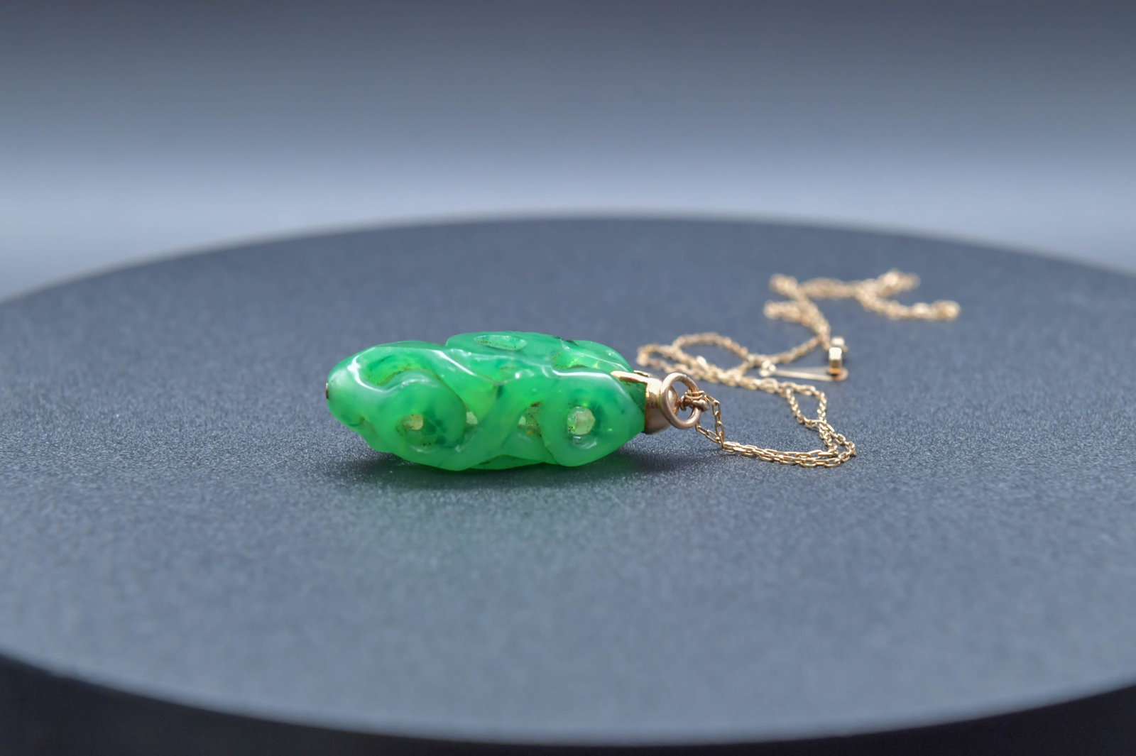Vintage Green Hollow Carving Pendant w/Marked 14K Gold Chain: Vintage Green Hollow Carving Pendant w/Marked 14K Gold Chain, Pendant size 1"1/2L x 1/2"W; 14K chain 17"L; Total weight 12.8g., (Stand Not Included)