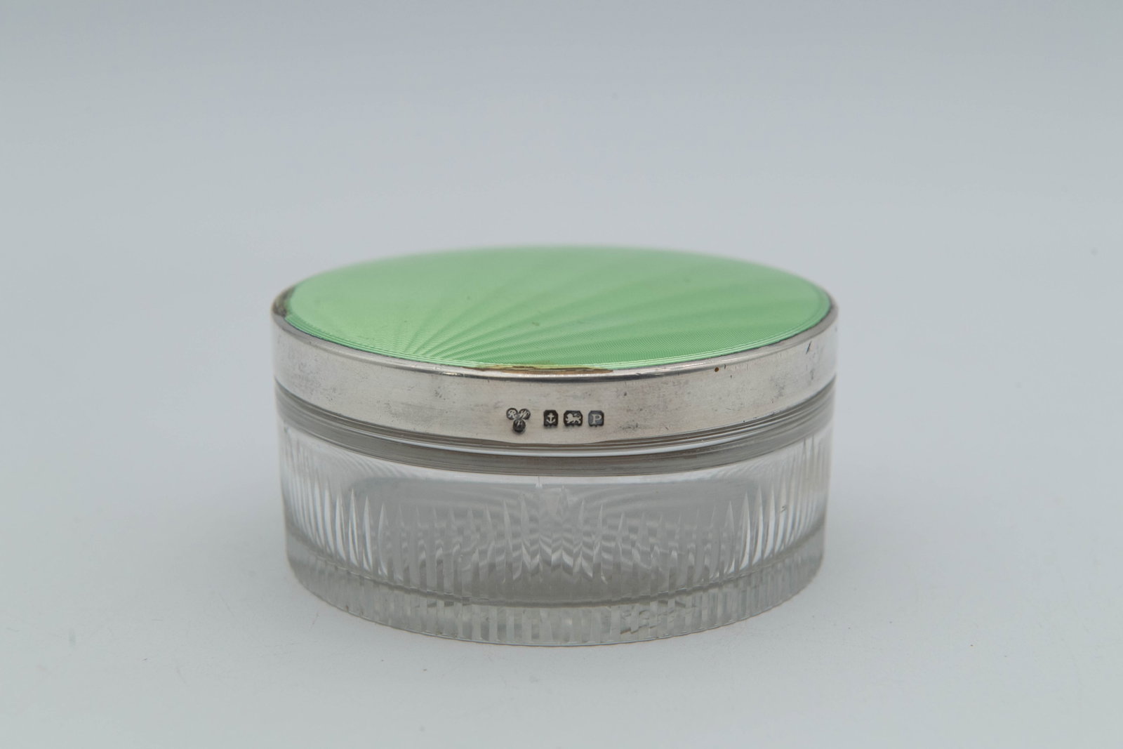 Marked Vintage Vanity Powder Glass Jar w/Apple Green Guilloche Enamel Lid & Silver Casings: Marked Vintage Vanity Powder Glass Jar w/Apple Green Guilloche Enamel Lid & Silver Casings. Measures 3"1/2 x 1"1/2. Overall in good vintage condition, the enamel has minor chips at the rim.