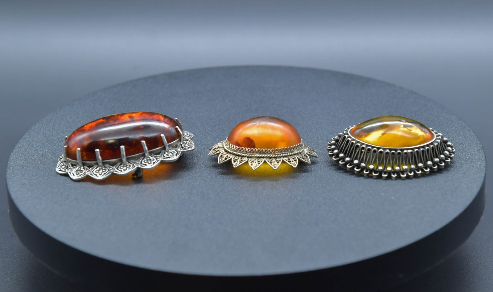 Lot of 3 Vintage Baltic Amber Brooch w/Silver & Silver-Tone Filigree Frame: Lot of 3 Vintage Baltic Amber Brooch w/Silver & Silver-Tone Filigree Frame. 1)Marked 925 exquisite sterling silver filigree pendant/brooch with amber inlay, 2"1/4 x 1"1/2, weight 24.8g, In good condit