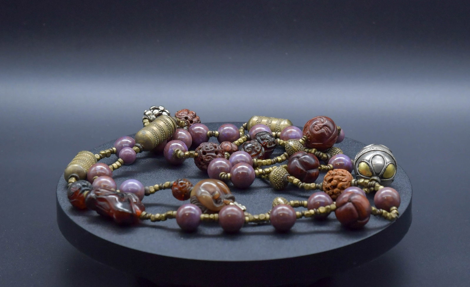 Vintage Customized Necklace w/Carved Beads & Metal Accents: Vintage Customized Necklace w/Carved Beads (Amber, Walnut Kernel, Horn, Purple Stone & Silver Tone Beads) & Metal Accents. Carved Amber beads 12mm & 14.8mm (4pcs), A amber face carving 30.8mm x 25mm; 