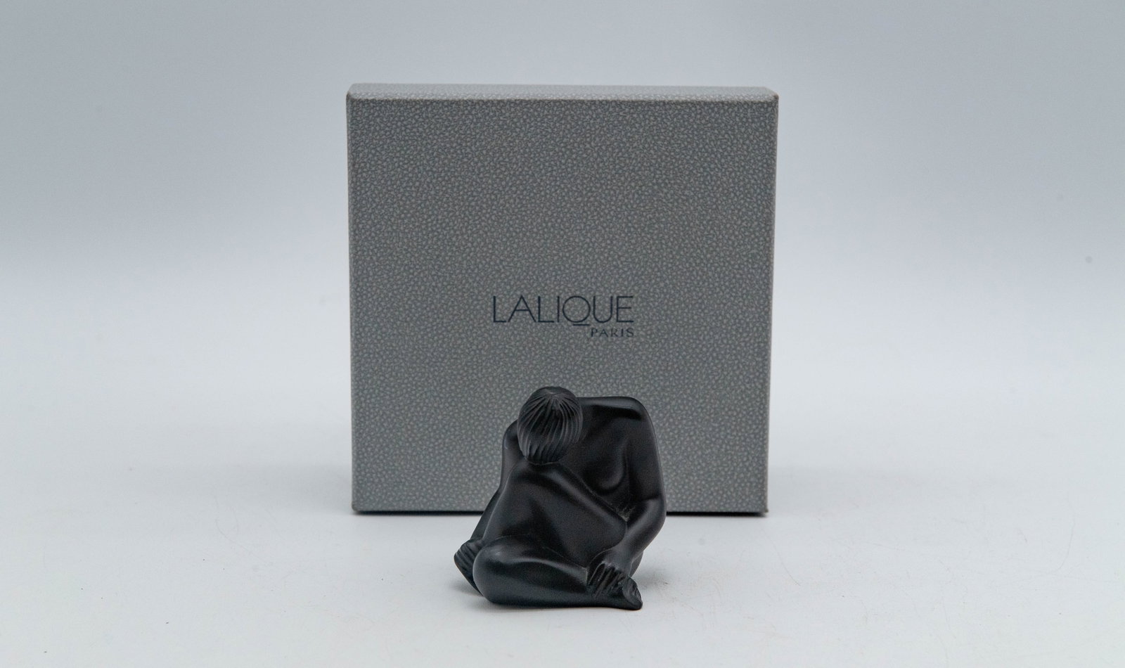 Vintage Black Crystal Nude Figure Sculpture w/Etched "Lalique France": Vintage Black Crystal Nude Figure Sculpture w/Etched "Lalique France" w/Box. Measures 2"1/2H x 2"1/2W x 2"1/4D. Overall in good condition. Minor surface scratches are present on the underside, along w