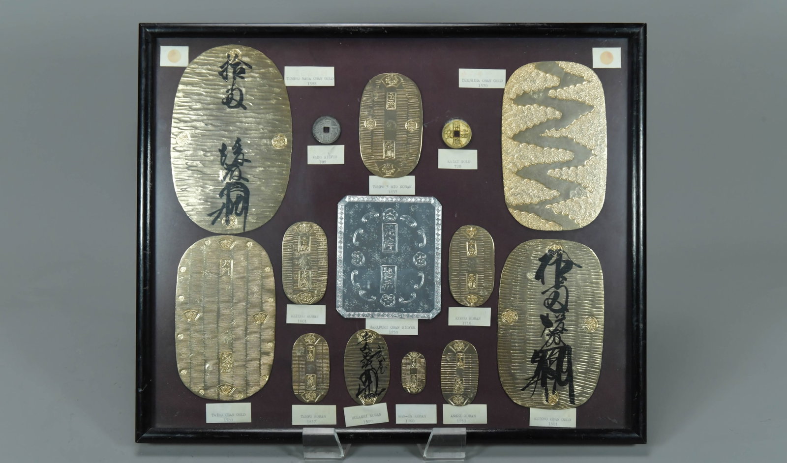 Framed Japanese Coins, Set of Koban & Oban: Framed Japanese Coins, Set of Koban & Oban. Frame size 17"1/2 x 14"1/2, (Stand Not Included)