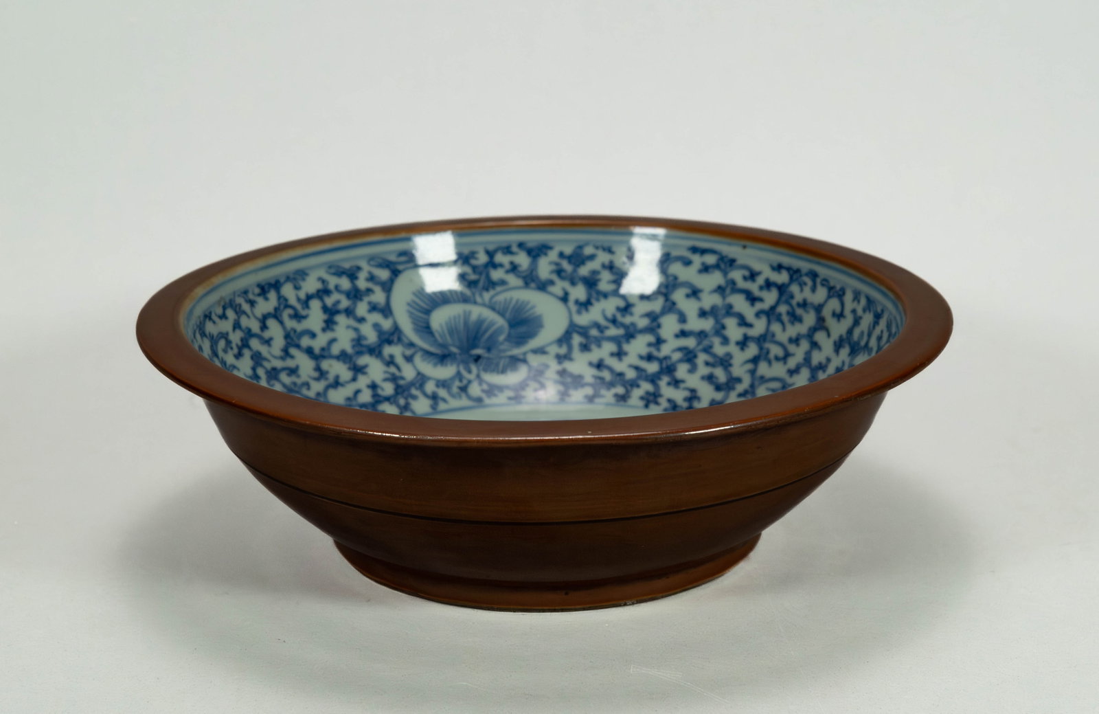 Vintage Chinese Blue & White Porcelain Bowl, Batavia Brown Glaze on the Exterior: Vintage Chinese Blue & White Porcelain Bowl, Batavia Brown Glaze on the Exterior. Measures 11" x 3"1/4. Overall in good vintage condition with minor wear consistent with age. (Stand Not Included)