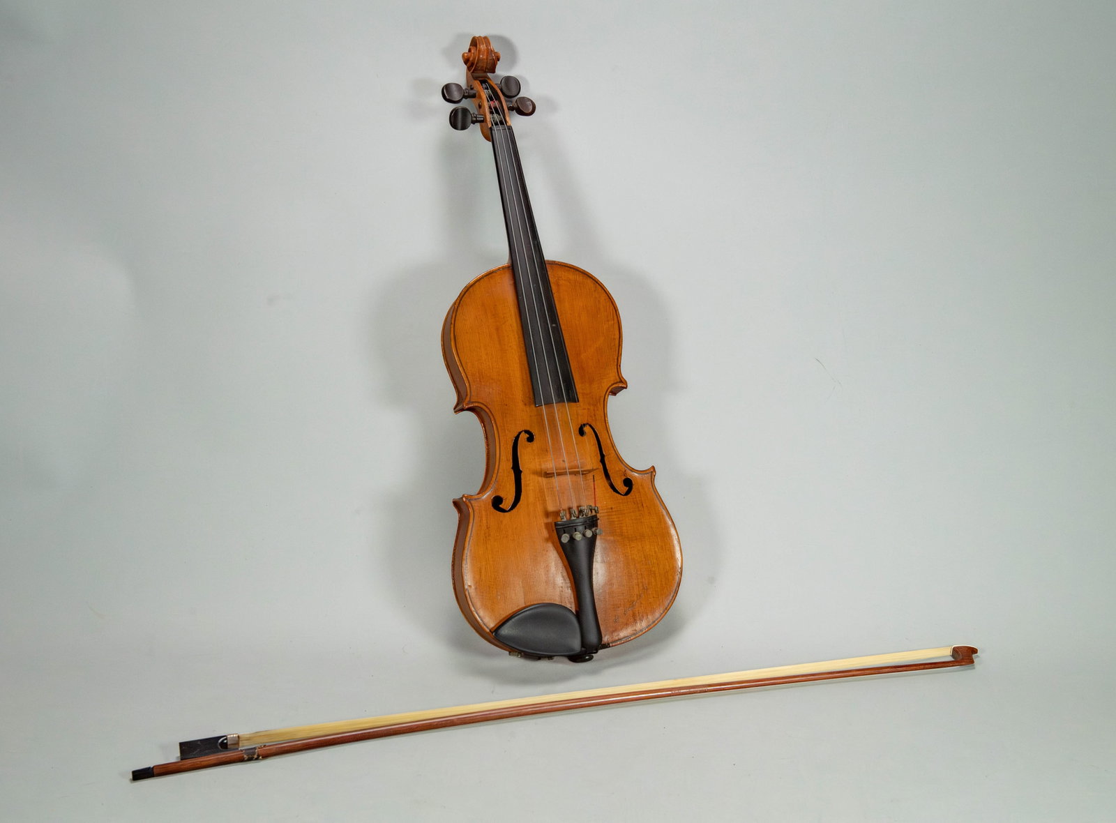 Vintage Violin Labeled "Antonius Stradivarius, Made in Germany": Vintage Violin Labeled "Antonius Stradivarius, Made in Germany". Measures approx. 23"1/2L x 8"W x 1"1/2D. The violin is labelled internally with the name of the maker and the place. All information pr