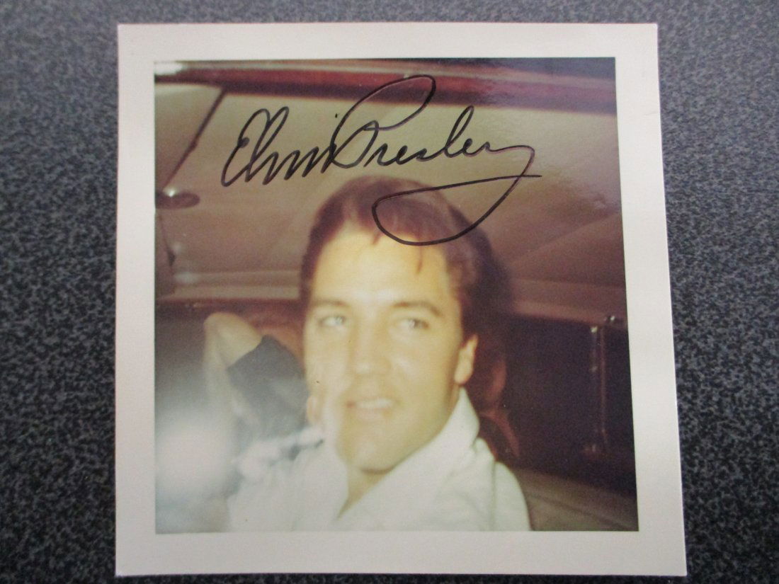 Elvis Presley Signed Polaroid Photograph from 1966: Capture the essence of rock 'n' roll royalty with this rare gem – an original Polaroid photograph signed by the King himself, Elvis Presley, dating back to 1966. This vintage snapshot freezes a mome