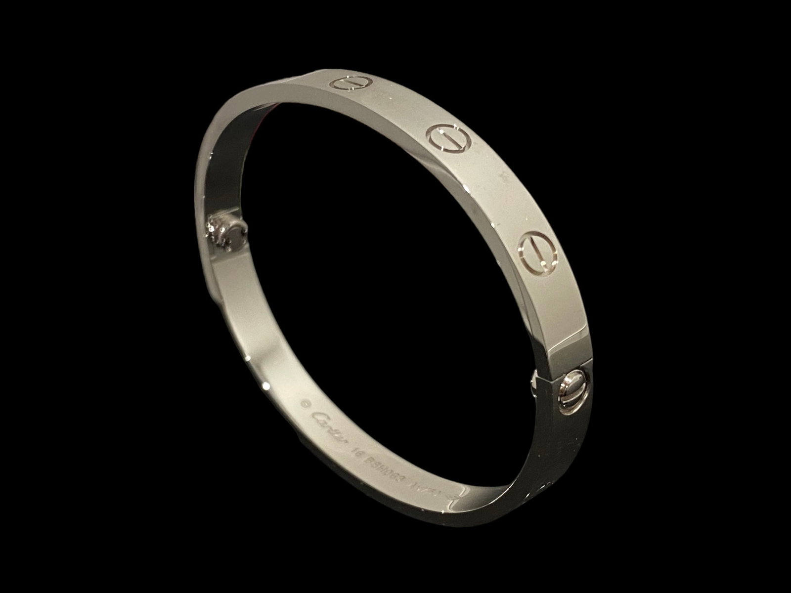 CARTIER LOVE BRACELET 18K WHITE GOLD SIZE 16: CARTIER LOVE BRACELET 18K WHITE GOLD SIZE 16Condition: Like new.Brand: Cartier.Metal: 18k white gold.Bracelet size: 16..Comes with original box or pouch.