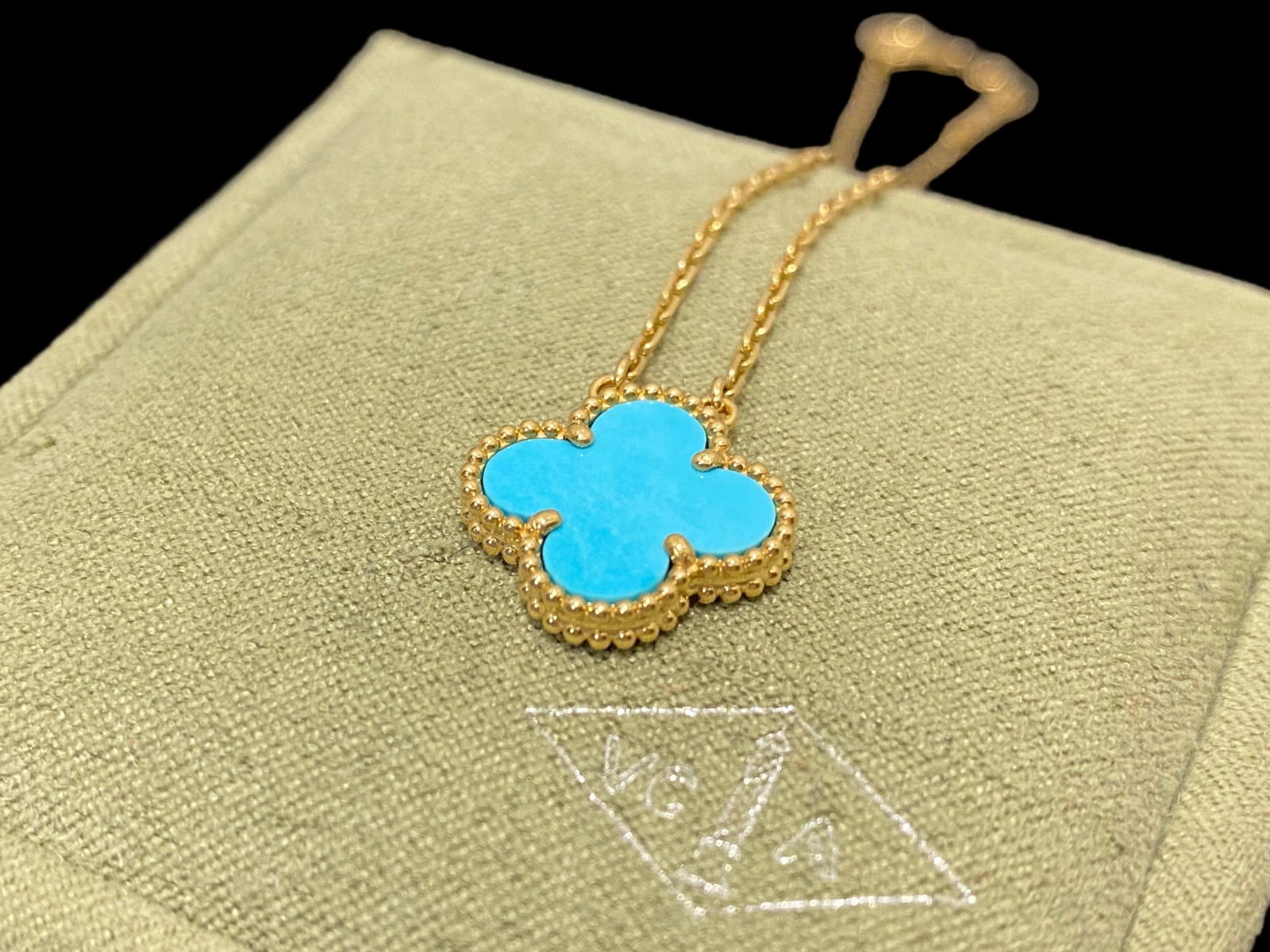Van Cleef & Arpels 18K Yellow Gold Turquoise Vintage Alhambra Pendant Necklace: Van Cleef & Arpels 18K Yellow Gold Turquoise Vintage Alhambra Pendant Necklace Condition: Good Material: 18K Yellow Gold Gem Stone: Turquoise Motif Dimensions: 15 mm x 15 mm