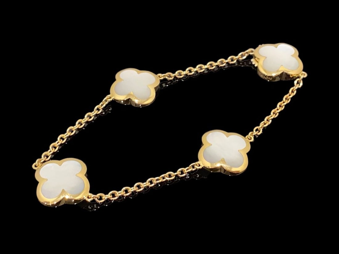 Van Cleef & Arpels Alhambra bracelet, 4 motifs. 18k yellow gold, Mother-of-pearl: Van Cleef & Arpels Alhambra bracelet, 4 motifs. 18k yellow gold, Mother-of-pearl Condition: Like new. Brand: Van Cleef & Arpels. Metal: 18k yellow gold. Gem stone: Mother-of-pearl. Retail price: $ 6,9