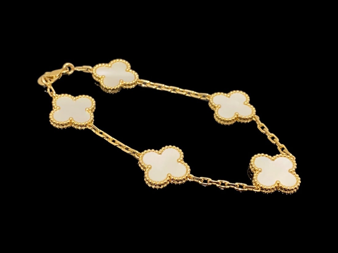 Van Cleef & Arpels Vintage Alhambra Bracelet 5 Motifs 18K Yellow Gold Mother-of-Pearl: Condition: Like new Brand: Van Cleef & Arpels Metal: 18k yellow gold Gem stone: Mother-of-pearl Comes with original box or pouch.