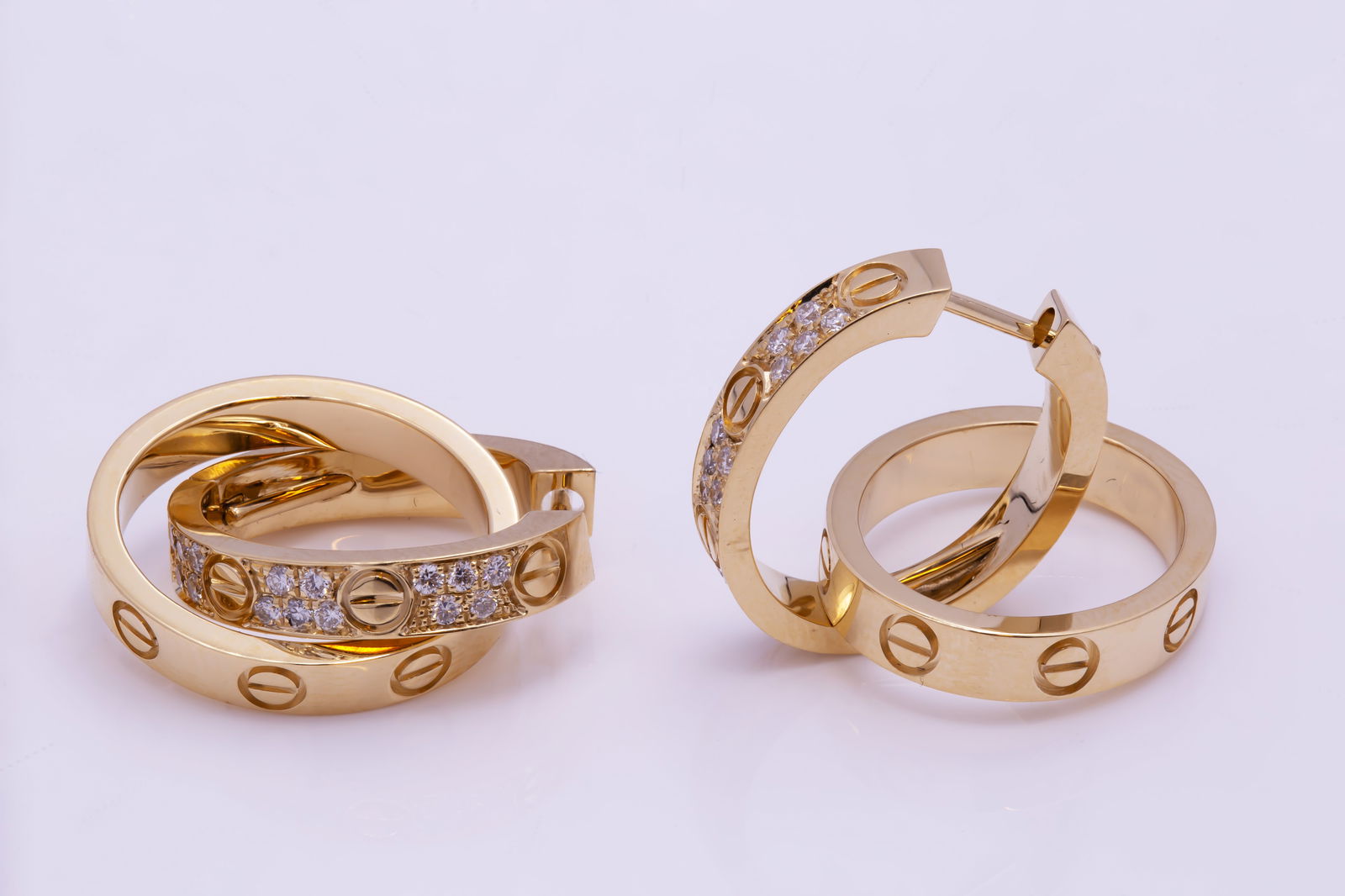 Cartier 18k Yellow Gold Diamond Love Earrings: 18K yellow gold (750/1000), each set with 15 brilliant-cut diamonds totaling 0.13 carats. Removable bottom hoops. Width: 3.3 mm.Weight 11.32gRetail:$6,350