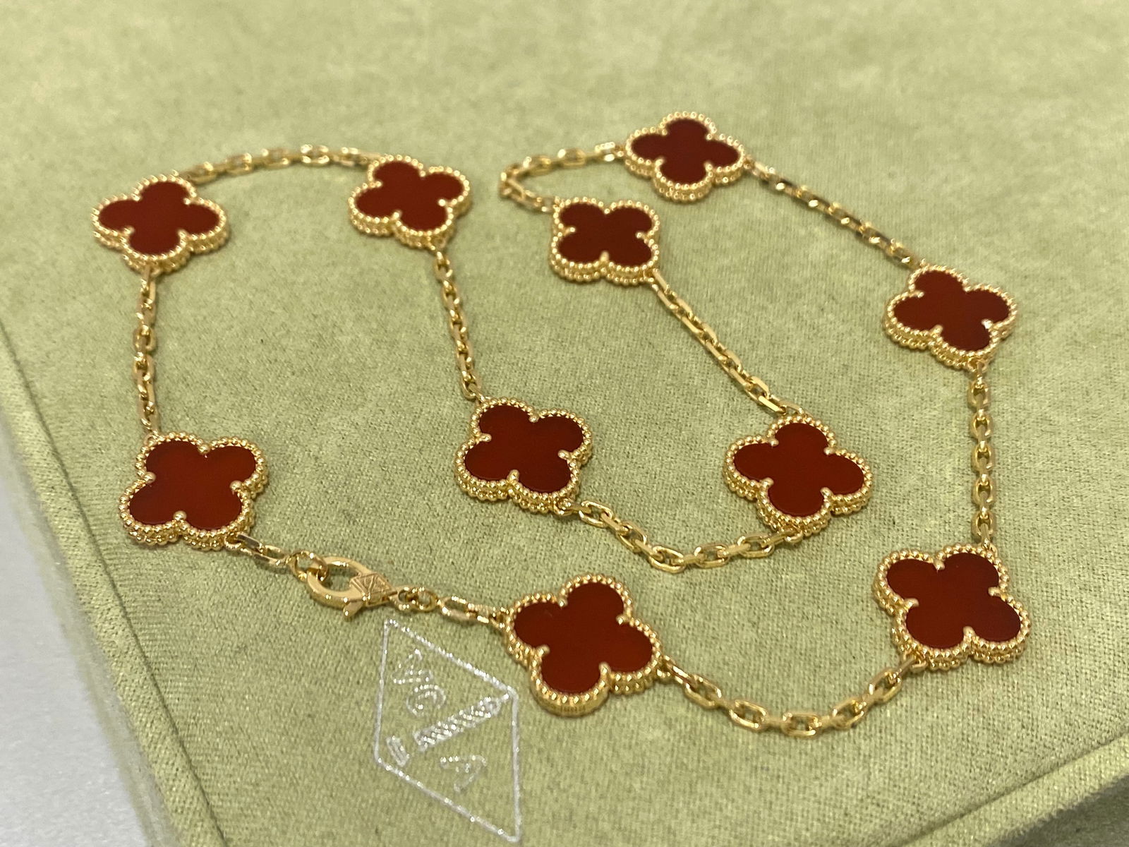 Van Cleef and Arpels Vintage Alhambra necklace, 10 motifs. 18k yellow gold, Carnelian: Condition: Like new. Brand: Van Cleef & Arpels. Metal: 18k yellow gold. Gem stone: Carnelian Motif dimensions: 15mm x 5mm Retail price: $ 9,200 Comes with an original box or pouch.