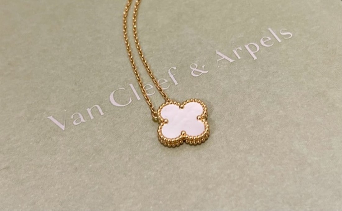 Van Cleef & Arpels 18k Yellow Gold Mother Of Pearl Vintage 15MM Alhambra Pendant: Van Cleef & Arpels 18k Yellow Gold Mother Of Pearl Vintage 15MM Alhambra Pendant Brand: Van Cleef & Arpels Collection: Vintage Alhambra Metal: 18k Yellow Gold Stone: Mother Of Pearl Chain Length: 16.5