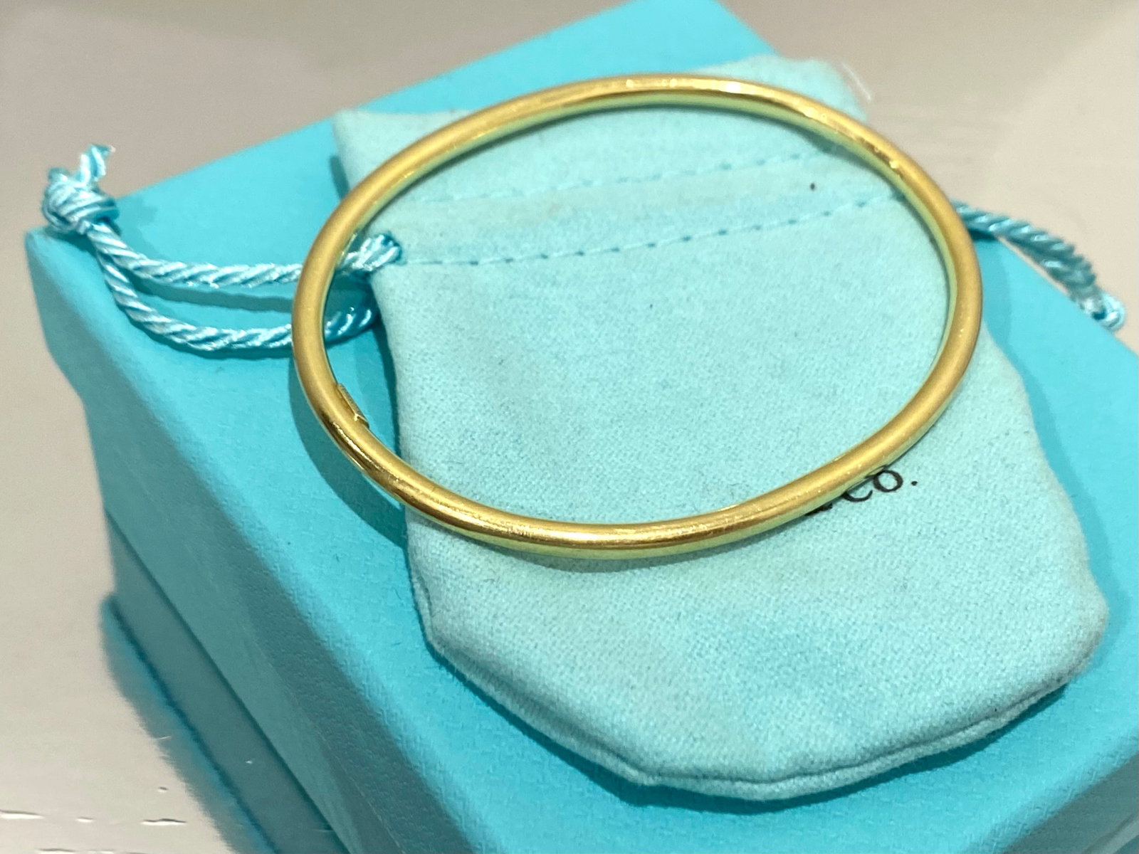 Tiffany & Co. 18K Yellow Gold 3.3mm Tube Oval Bangle Bracelet Rare 8.2 Grams: The bracelet is 3.3mm wide; weighs 8.2 grams; inside circumference of 7.25 inches and would fit comfortably up to a 6.75 inch wrist. Bracelet is a great everyday piece that you could enjoy wearing as 