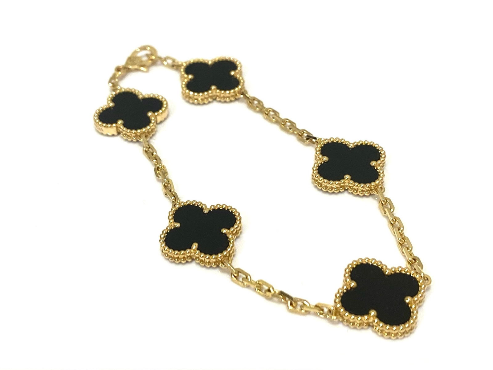 Van Cleef & Arpels Vintage Alhambra bracelet, 5 motifs. 18k Yellow gold, Onyx.: Condition: Like new. Brand: Van Cleef & Arpels. Metal: 18k Yellow gold.Gem stone: Onyx. Bracelet wrist size: 7.45 inches.Comes with an original box or pouch.