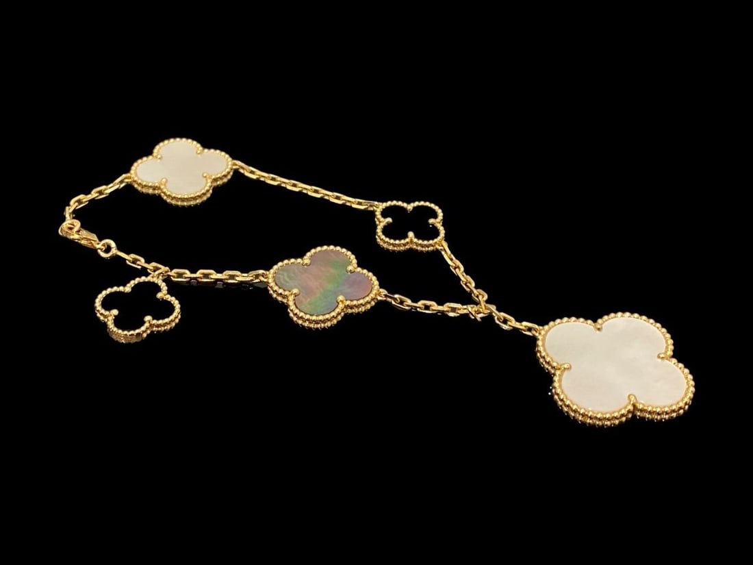 Van Cleef & Arpels Magic Alhambra bracelet 5 motifs 18k yellow gold Mother-of-pearl Onyx: Condition: Like new. Brand: Van Cleef & Arpels. Metal: 18k yellow gold. Gem stone : Onyx. Gem stone: Mother-of-pearl. Retail price: $ 7,950.Comes with original box or pouch.