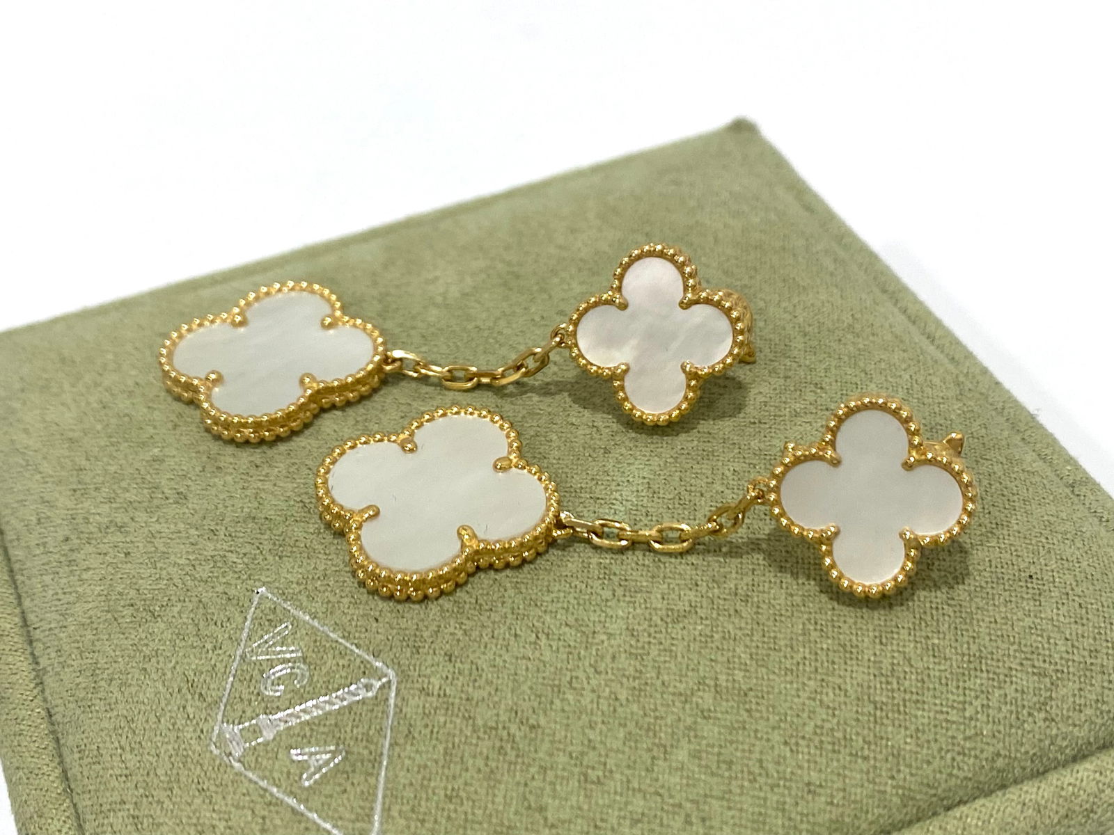 Van Cleef & Arpels Magic Alhambra Two Motifs Mother of Pearl Yellow Gold Earring: Creator: Van Cleef & Arpels Metal: 18k Gold, Yellow Gold Gem stone: Mother-of-pearl: 2 stones Clasp: Clip back with detachable stem in 18K yellow gold Comes with an original box or pouch.