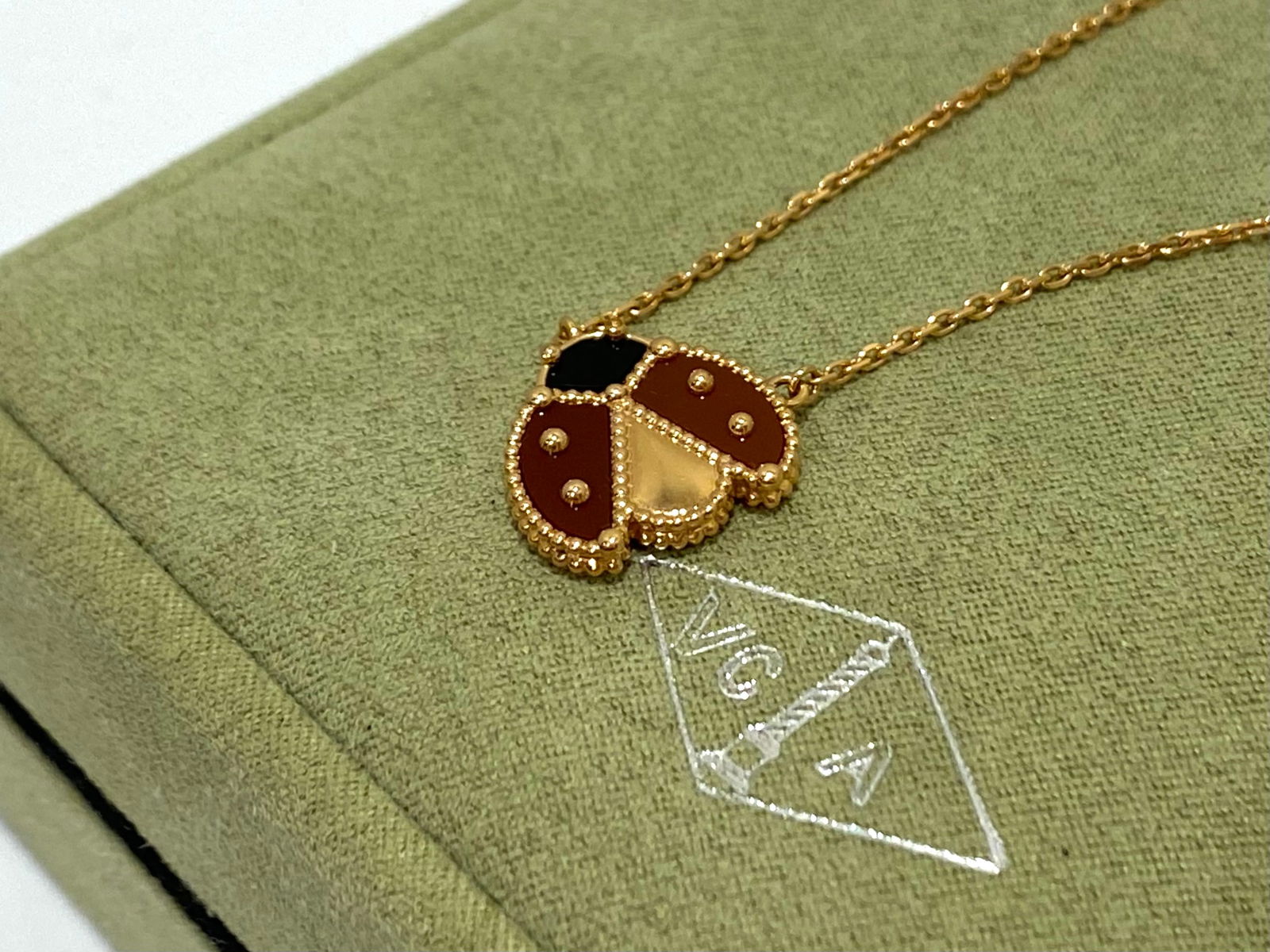 Van Cleef & Arpels Open Wings Ladybug Lucky Spring Pendant, Carnelian and Onyx, 18K rose gold (1 of 6)