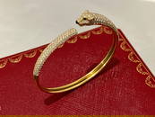 PANTHERE DE CARTIER BRACELET Yellow gold, onyx, emeralds, diamonds