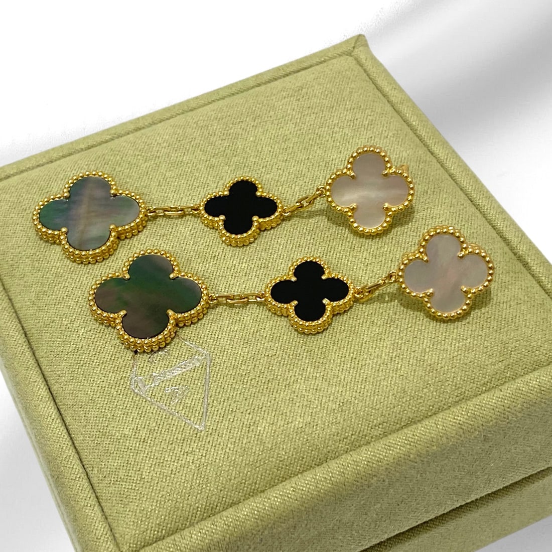 Van Cleef & Arpels Magic Alhambra Mother of Pearl & Onyx 3 Motif Earrings 18k Yellow Gold: Condition: Like New. Brand: Van Cleef & Arpels. Material: 18K Yellow Gold. GemStones: Onyx, Mother of Pearl. 4 stones Onyx: 2 stones. Comes in the Original Box or Pouch.