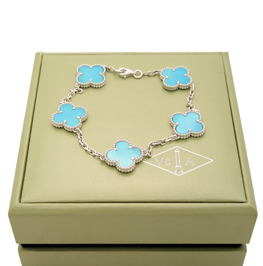 Van Cleef & Arpels Vintage Alhambra Turquoise 5 motifs bracelet in 18k White gold.: Condition: Like new. Brand: Van Cleef & Arpels. Metal: 18k White gold.Gem stone: Turquoise. 5 Stones. Clasp: Hallmark clasp in 18K white gold. Comes with an original box or pouch.