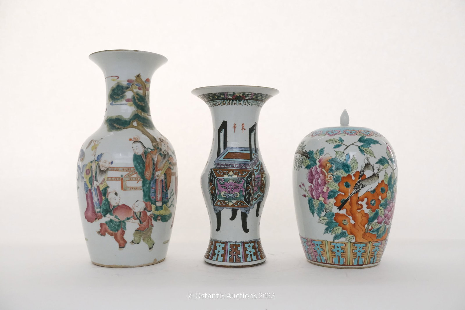 lot composed of 3 Chinese famille rose vases: A composed lot of three Chinese famille rose vases. an immortals scene added and treasure dÃ©cor and blackbirds in floral surroundings. 19-20 century. Height: 44,5cm - 36,5cm - 33,5cm