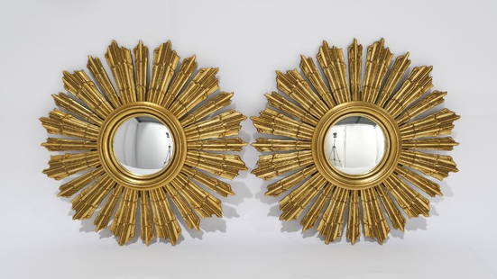 A vintage pair gilded wooden sun mirrors: A vintage pair gilded wooden sun mirrors. Made in Belgium around 1970. Height: 63.5 cm