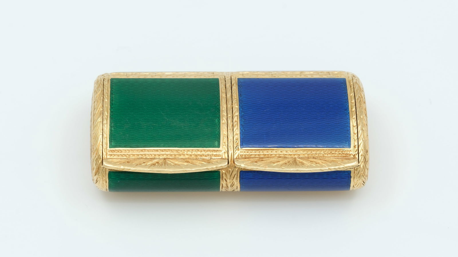 An 18ct gold, émail guilloché double pill-box: An 18ct gold,émail guilloché double pill-box Italy, 20th c 55 x 23 mm weight 48.8 g