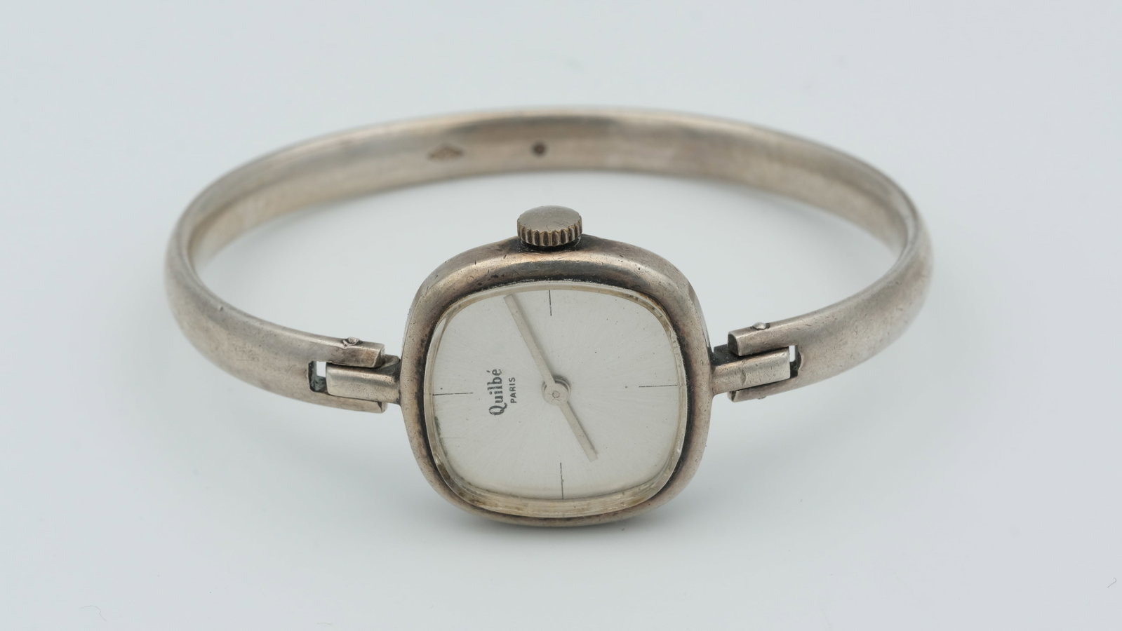 A Quilbé Paris silver bangle watch: A Quilbé Paris silver bangle watch 25 mm case 18cm wrist 33.4 g weight