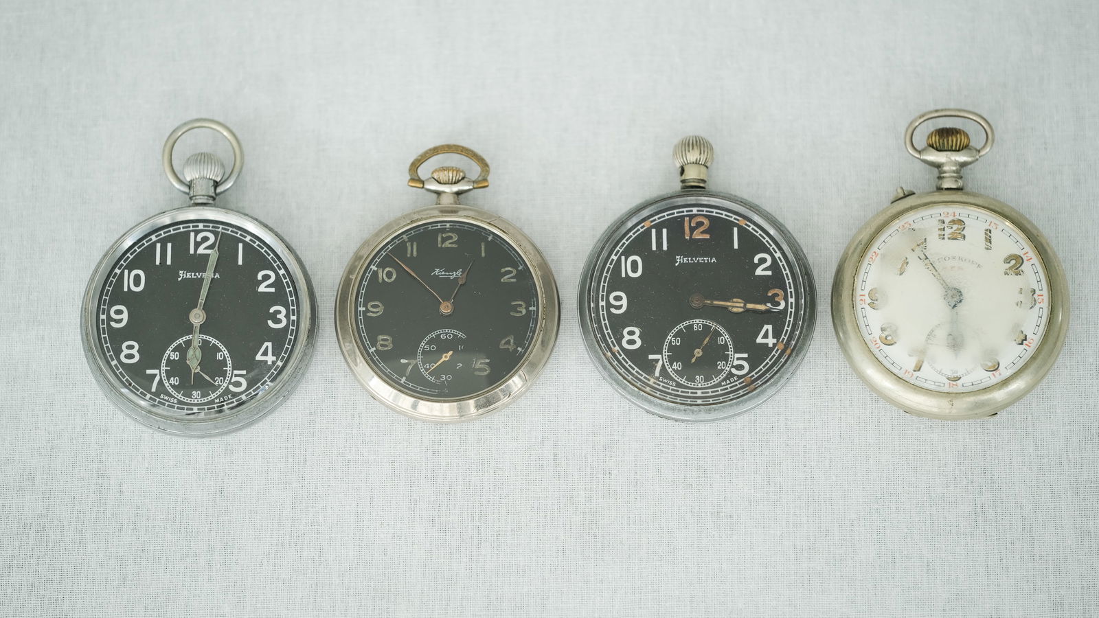 A lot of Four Military Pocketwatches by Helvetia, Kienzle and Roskopf (1 of 9)