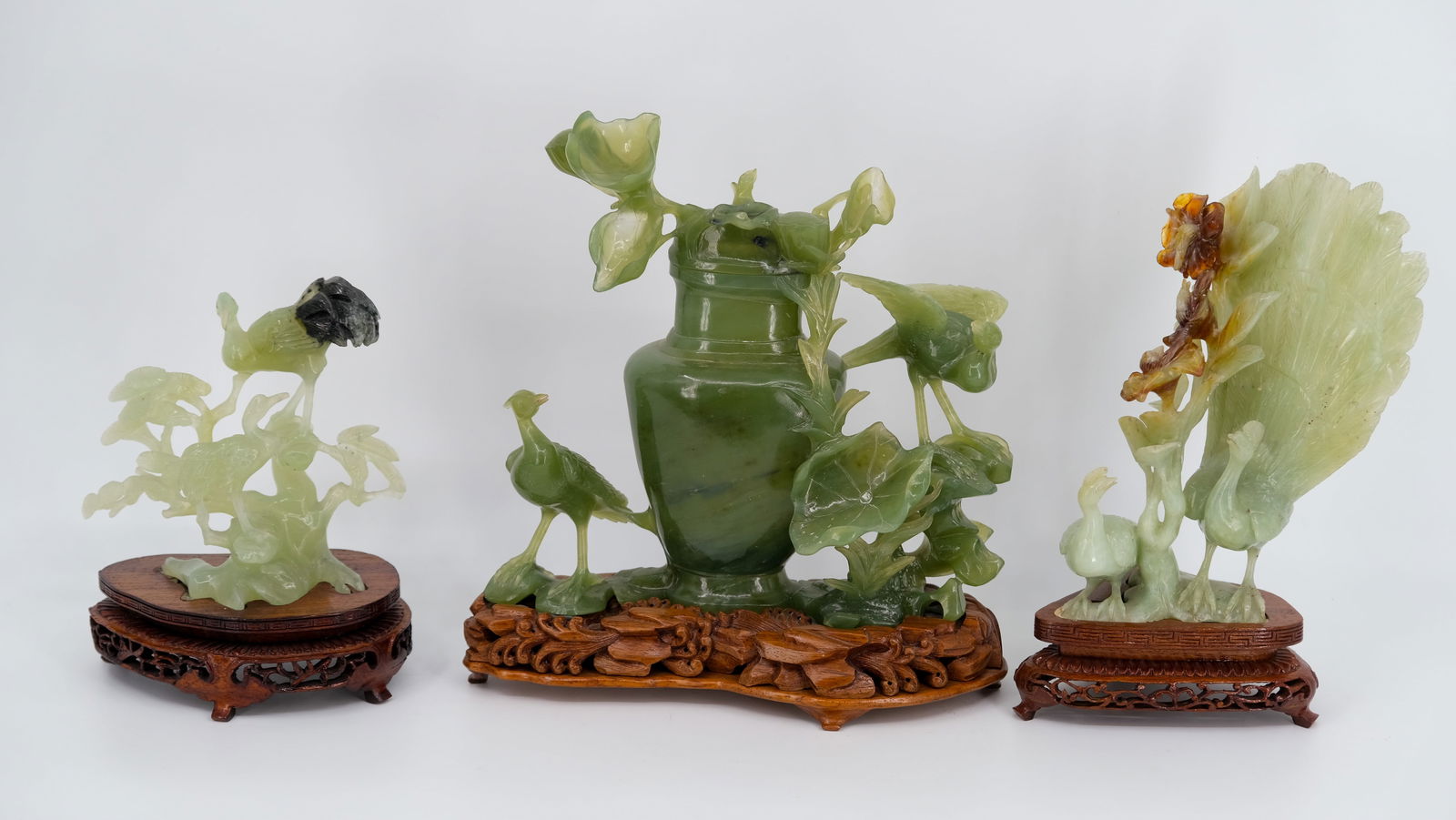 A lot of three Chinese green and spotted colored jade sculptures of birds and flowers (1 of 14)
