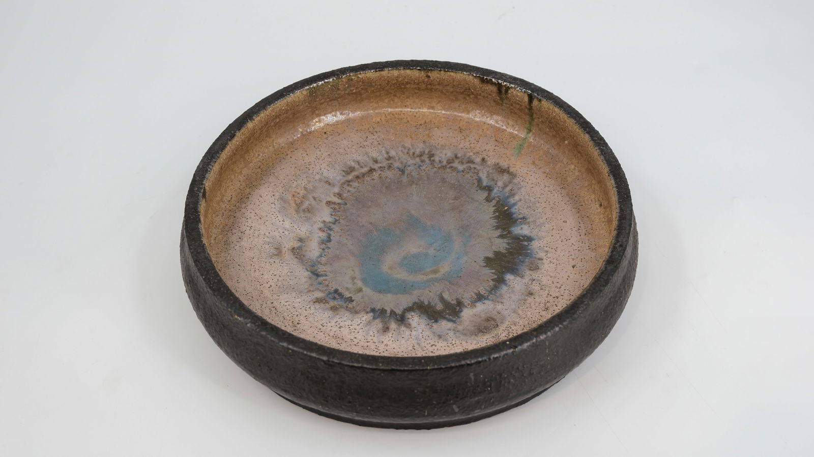 A Belgian glazed ceramic bowl signed by Van Walleghem and "Hand made, Unicum". 1960-1970's. (1 of 3)