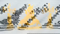 A large fire gilt bronze figural mythological group and clock set with figural candelabras. 19