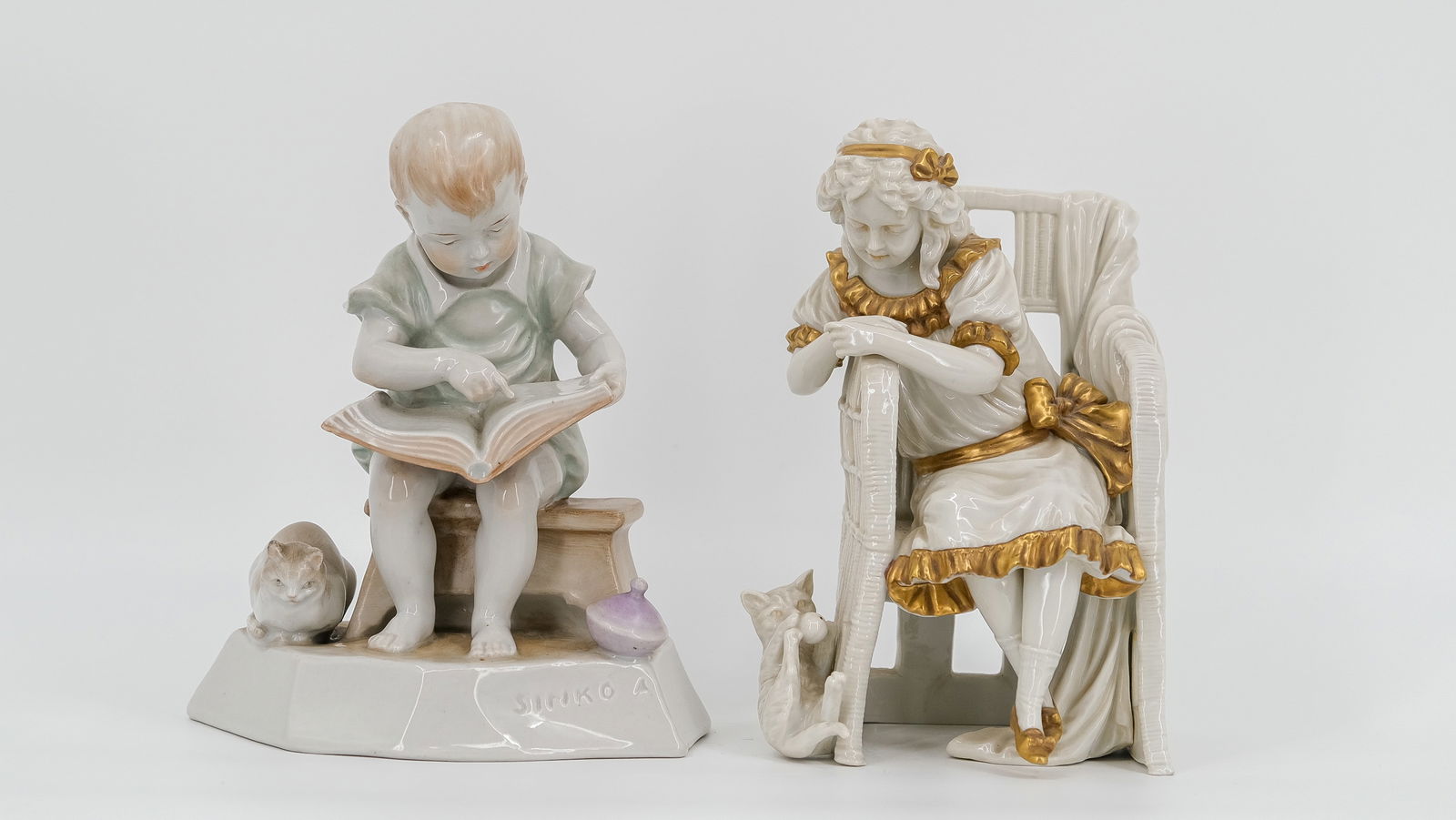 A lot of two charming various figural glazed porcelain groups marked by Scheibe Alsbach and Zsolnay.: A lot of two charming various figural glazed porcelain groups marked by Scheibe Alsbach and Andras Sinko for Zsolnay Hungary. Late 20th Century. H: 18 cm