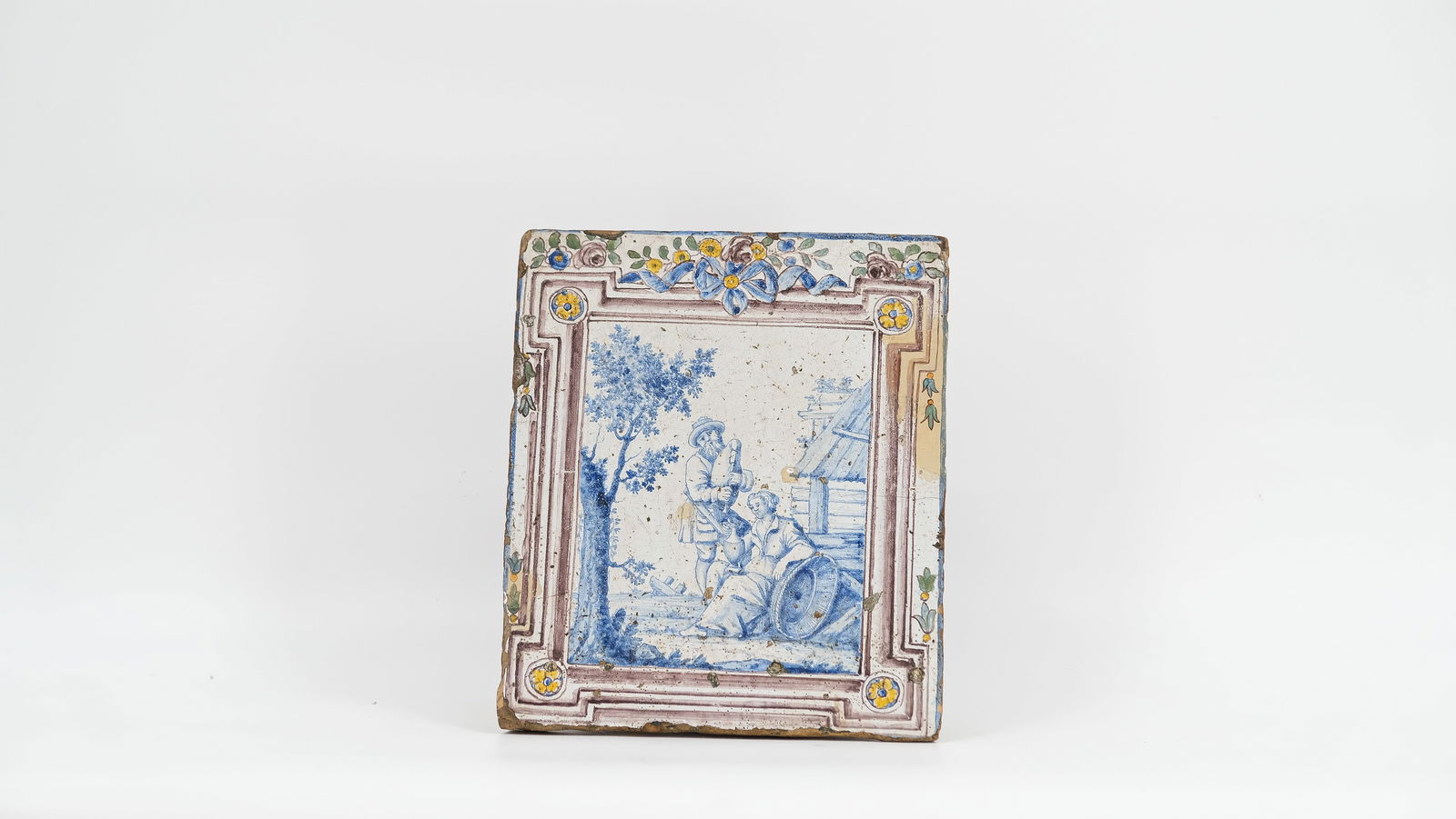 An early probably Dutch Delft polychrome decorated glazed ceramic built-in wall plaque (1 of 5)