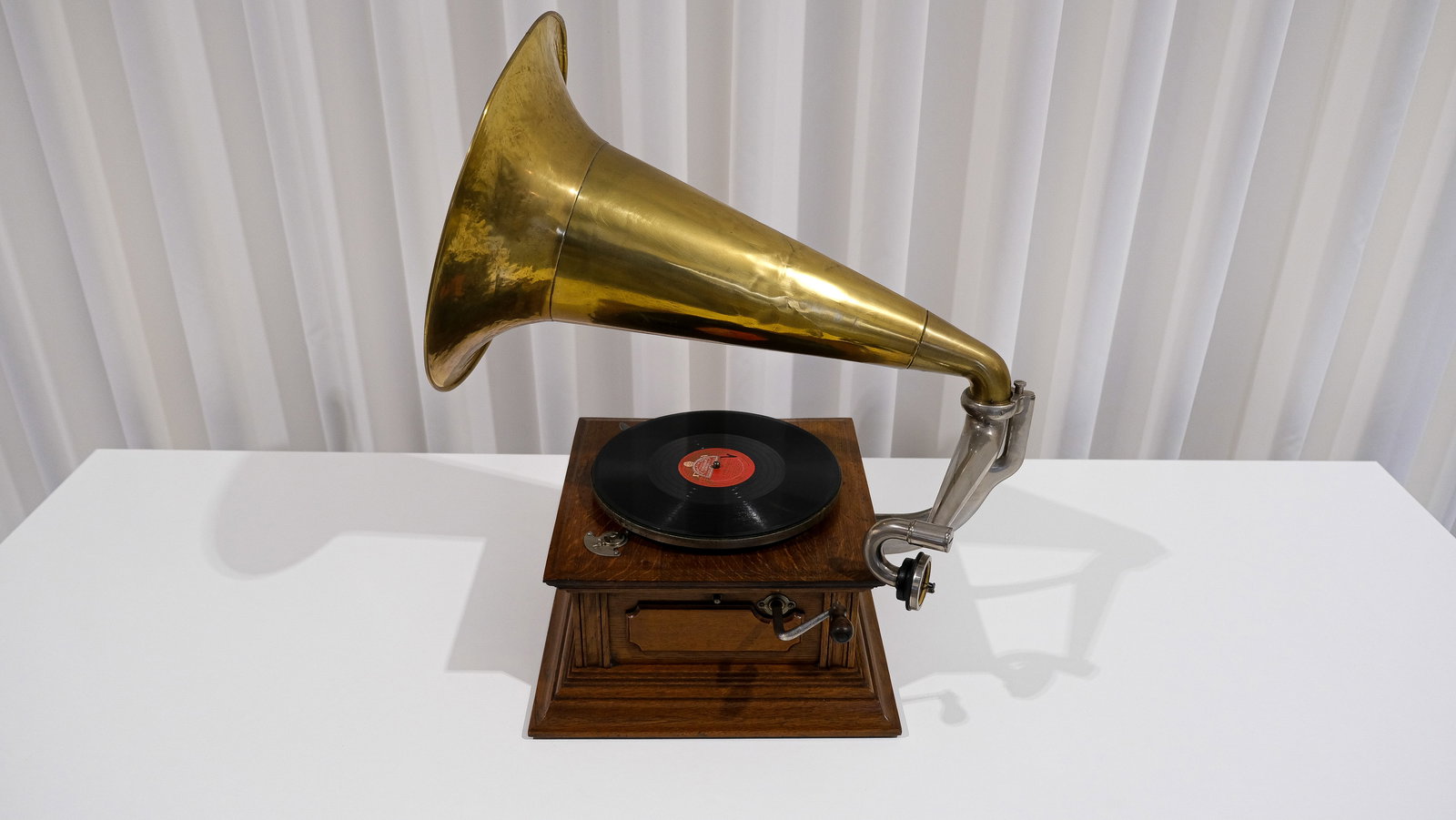 An antique phonograph with polished brass horn by His Master's Voice, circa 1900 (1 of 10)